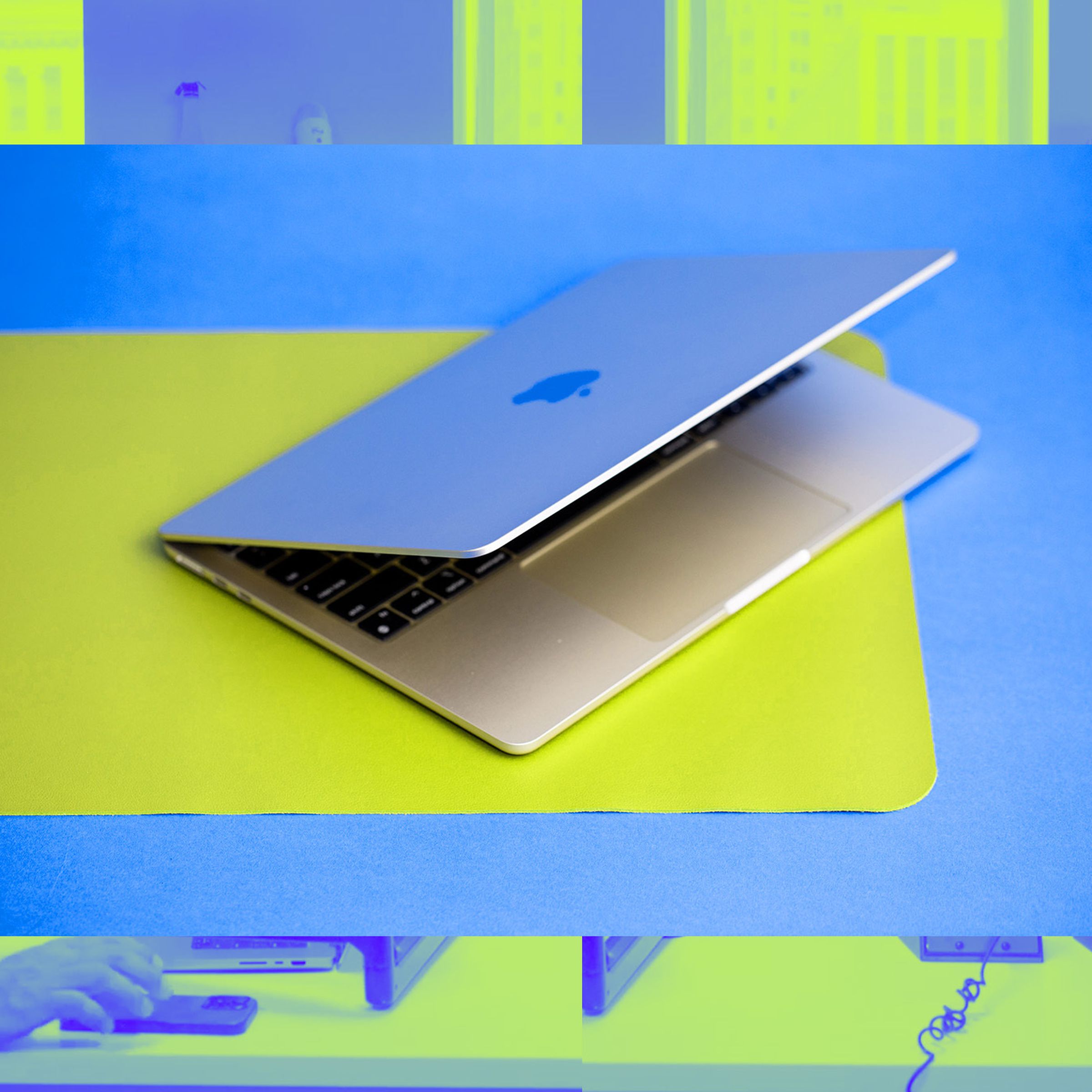 MacBook Air open on yellow desk