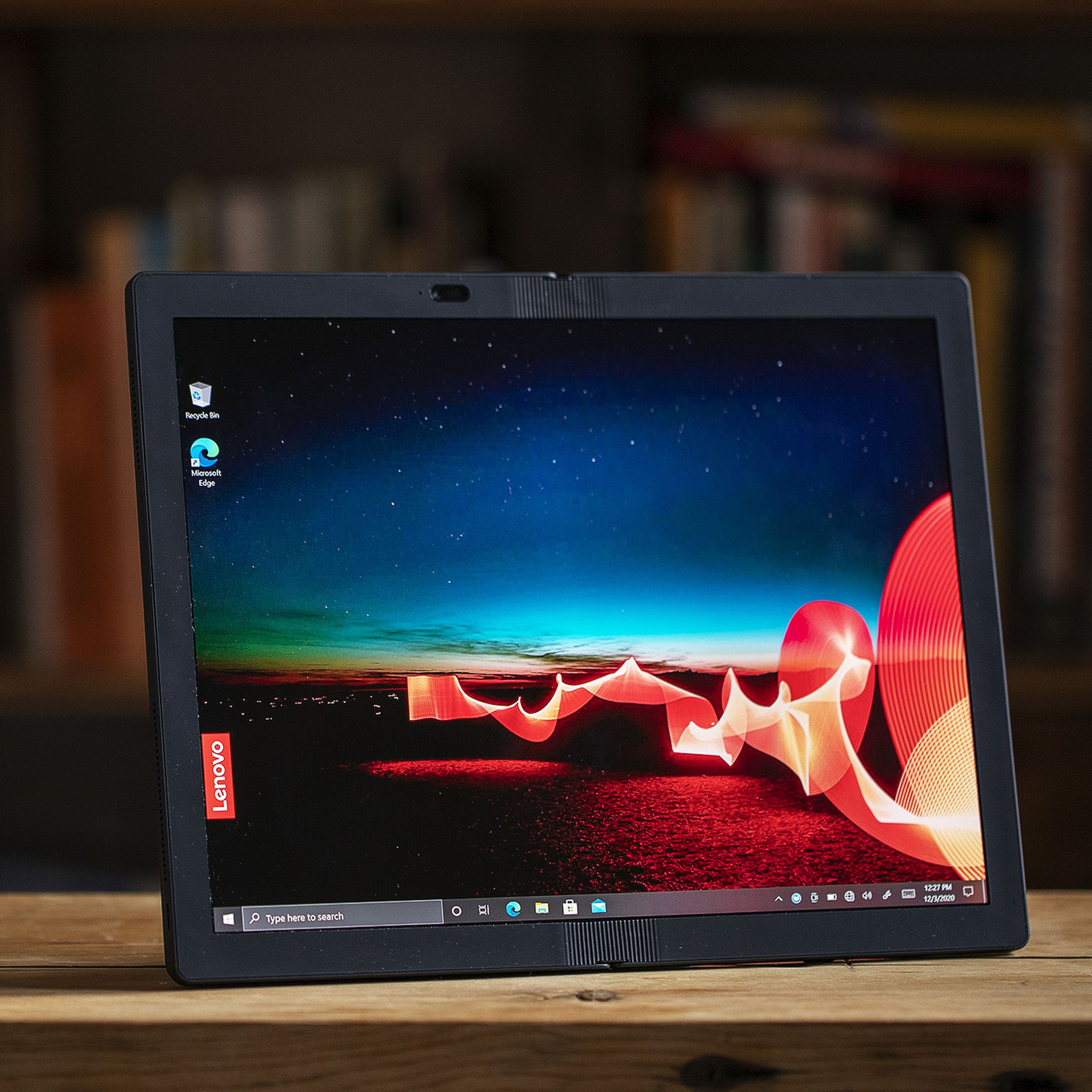 The Lenovo ThinkPad X1 Fold unfolded, propped up by its kickstand.