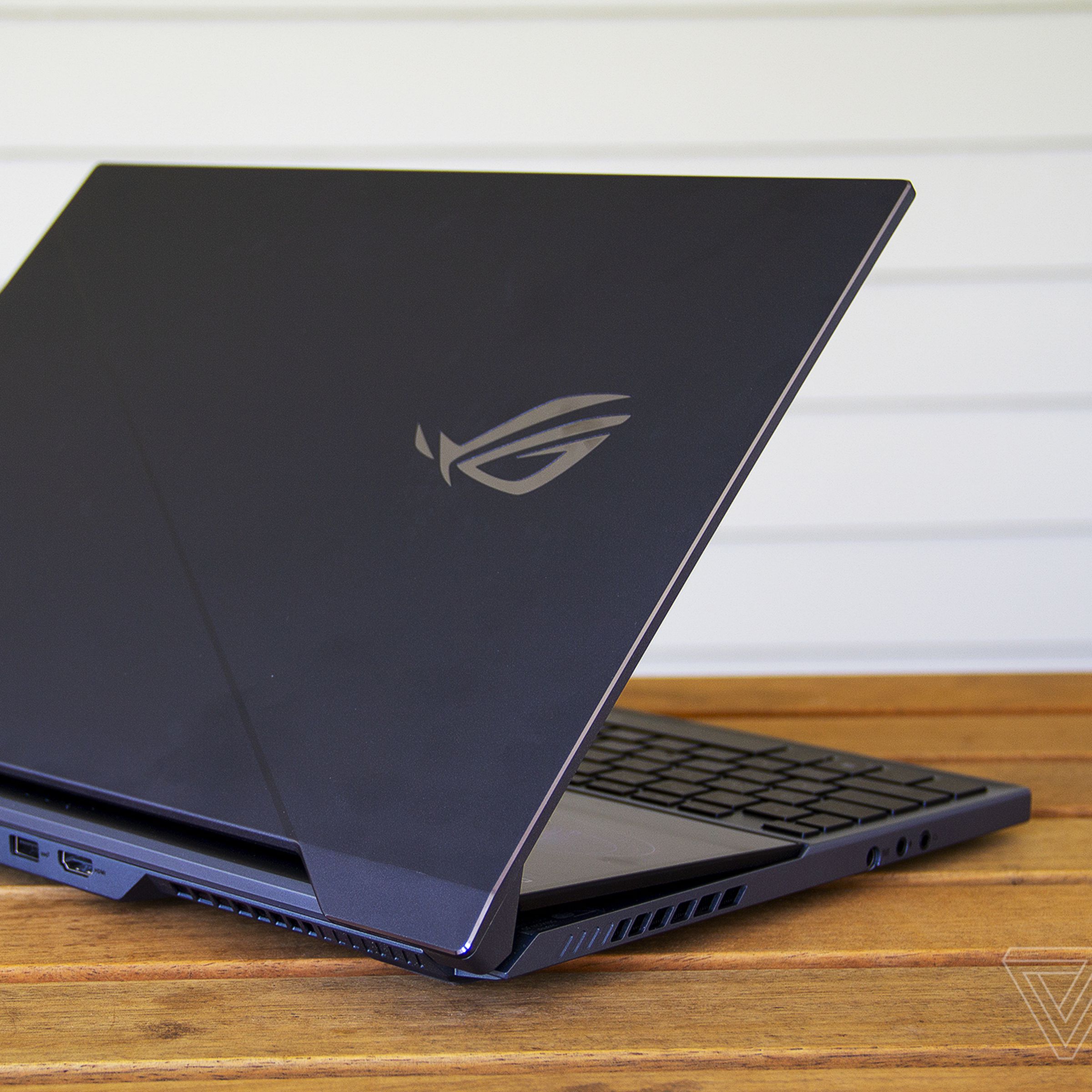 The Asus ROG Zephyrus Duo 15 half open from the back.