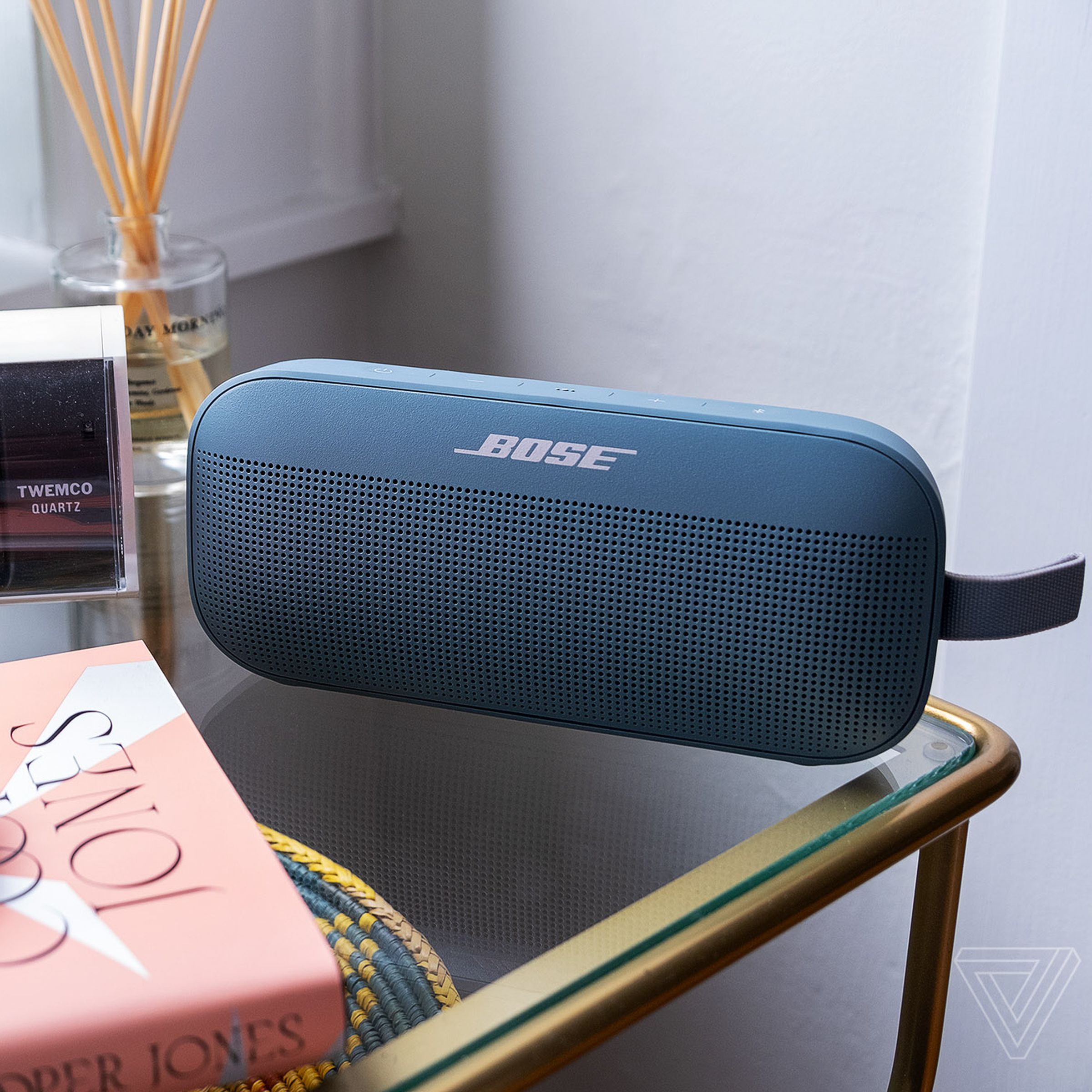 A photo of the Bose SoundLink Flex on a bedside table.