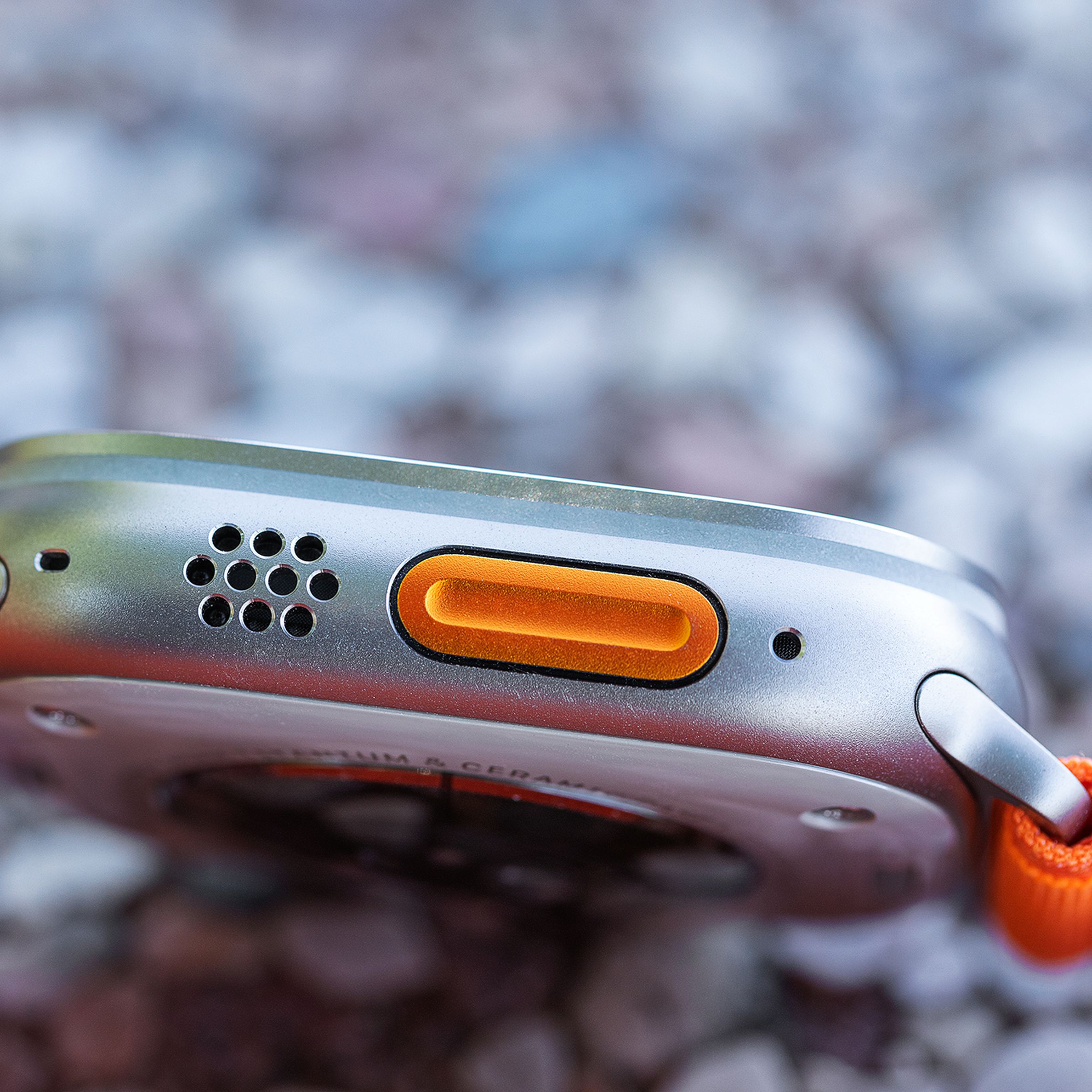 Close-up of the Action button, speakers, and microphones on the Apple Watch Ultra