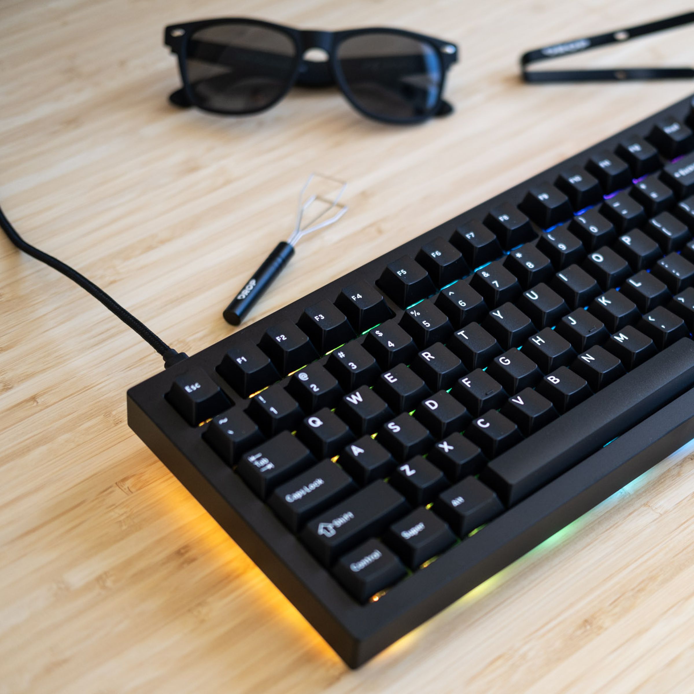 Sense 75 keyboard on a desk.