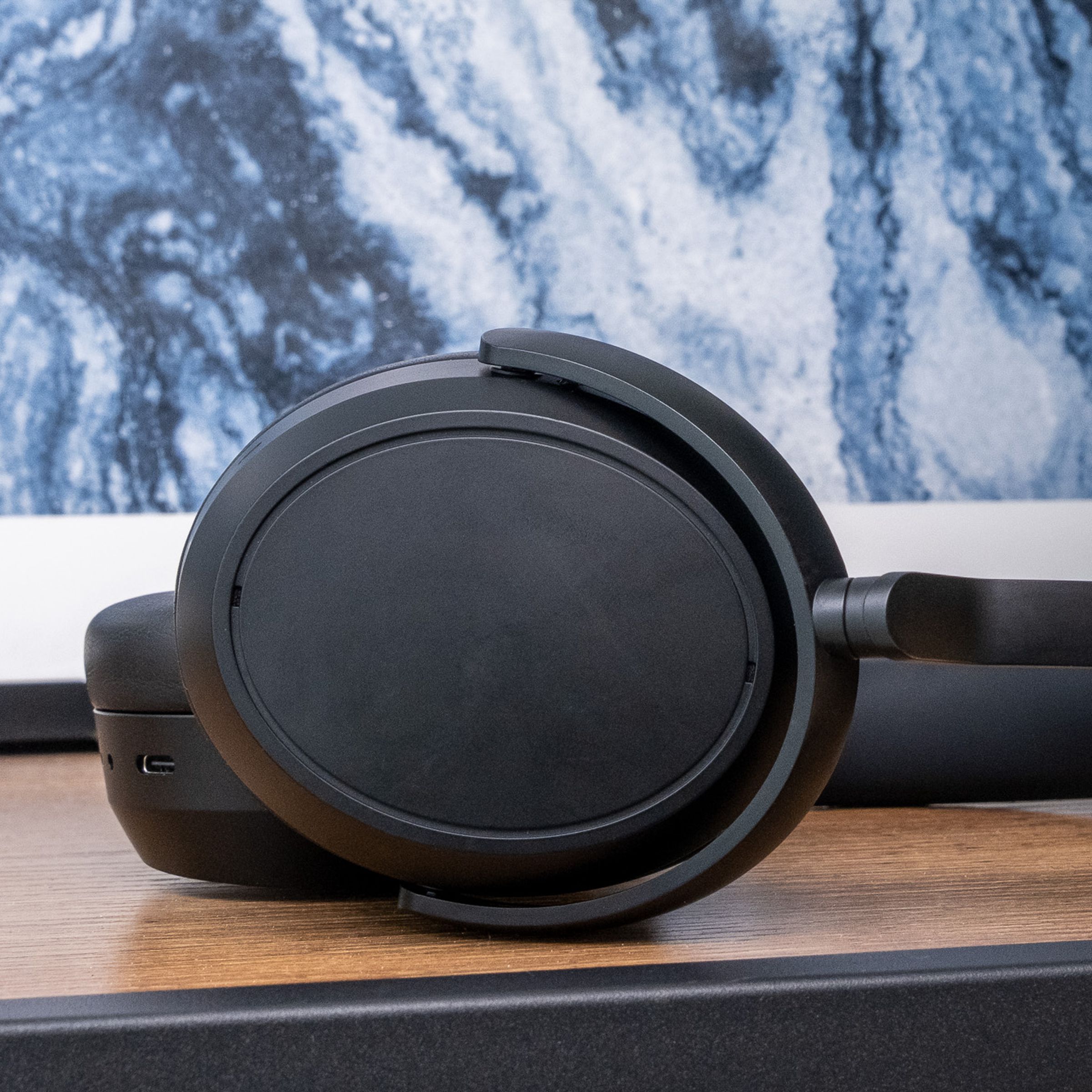 A photo of Sennheiser's Momentum 4 Wireless headphones on a table.