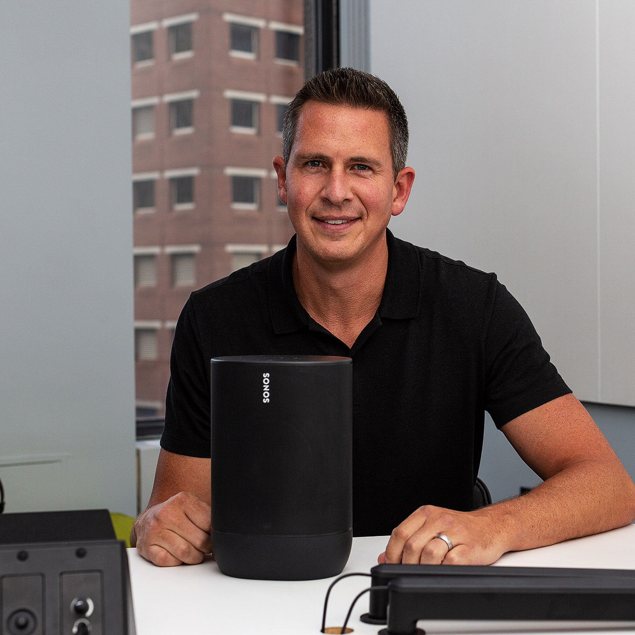 Sonos CEO Patrick Spence in August 2019, showing the then-new Sonos Move speaker.