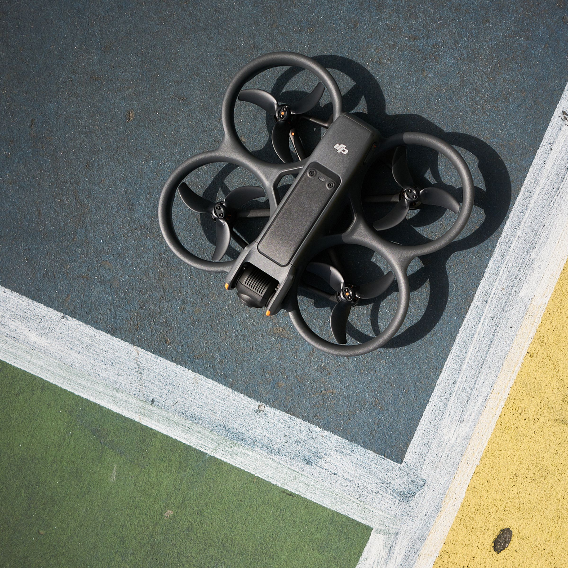 A photo showing DJI’s Avata 2 drone on pavement.