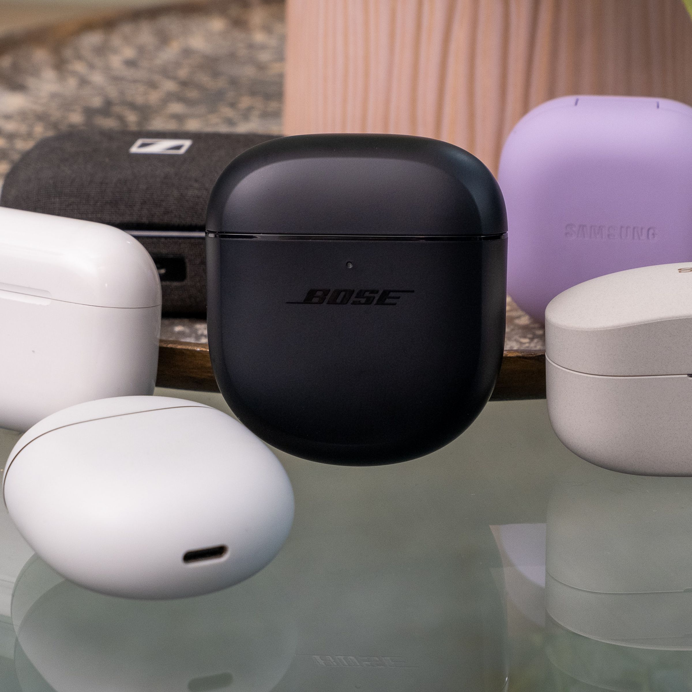 An image of multiple earbud cases from Bose, Sony, Apple, Google, Sennheiser, and Samsung.