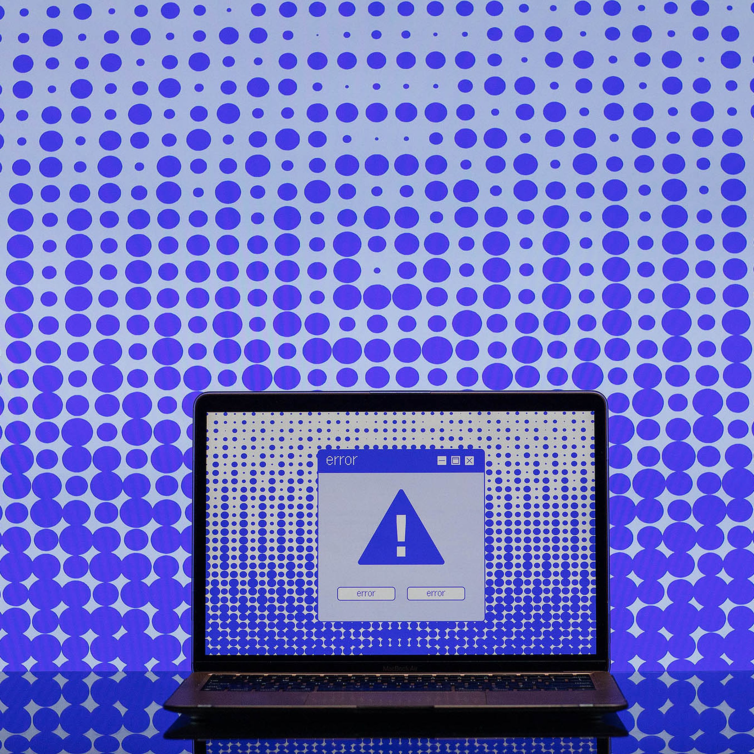 Illustration of a computer screen with a blue exclamation point on it and an error box.