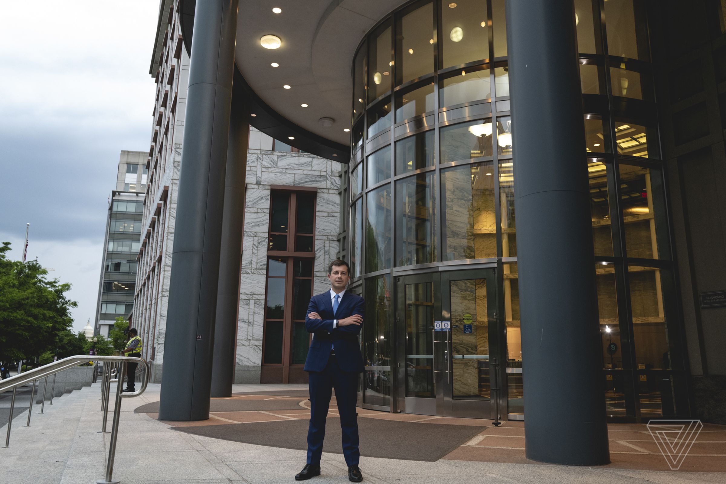 Secretary of Transportation Pete Buttigieg poses for a portrait at the Department of Transportation offices in Washington, DC.