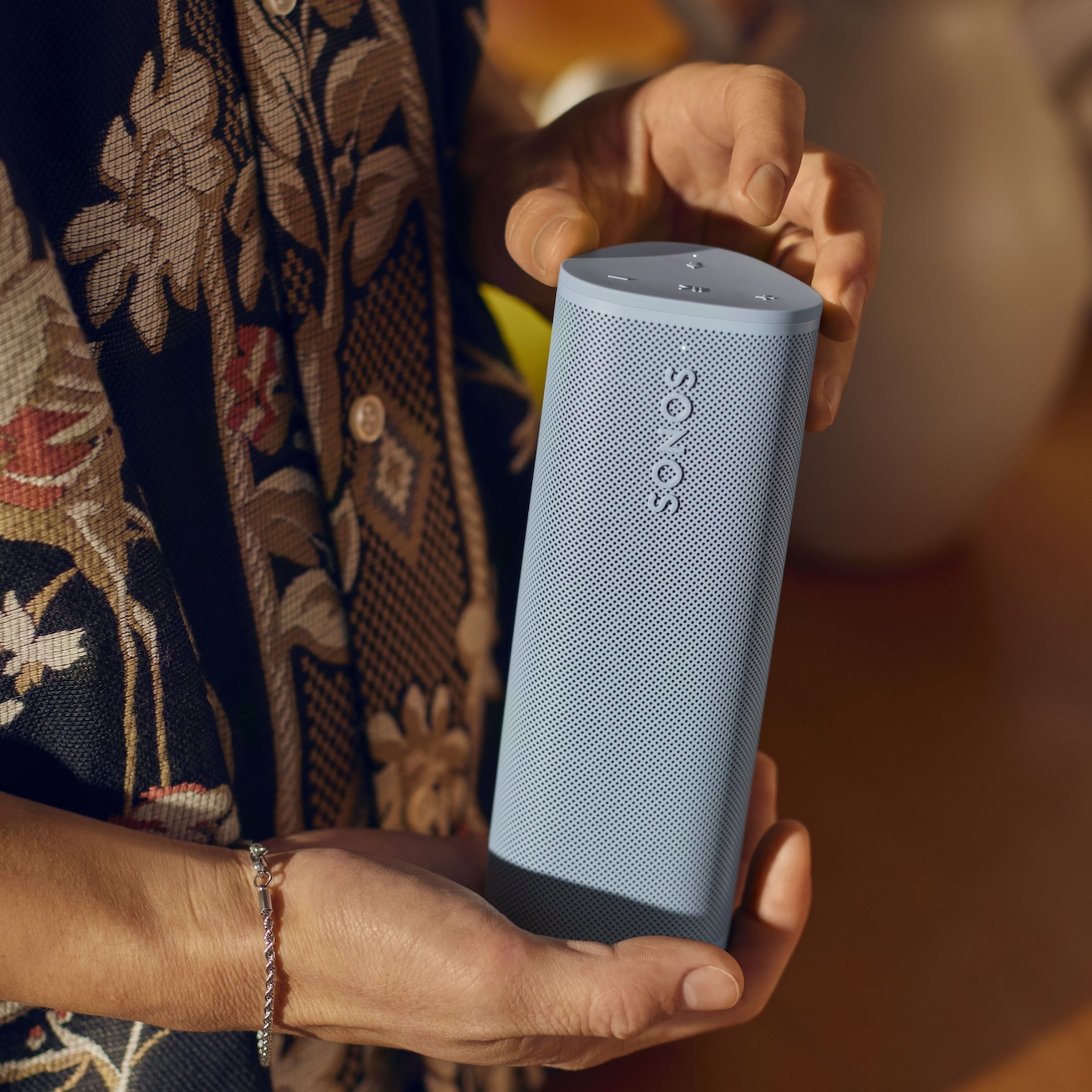 A marketing image of a blue Sonos Roam 2 speaker.