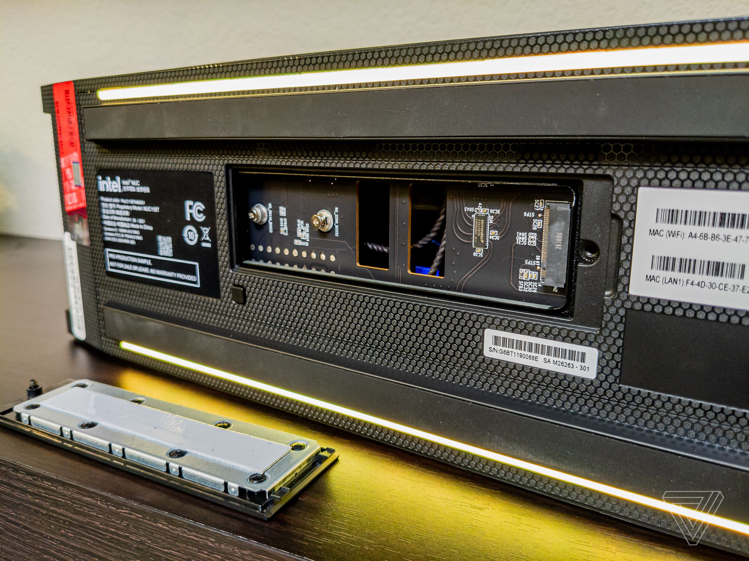 The extra-long 110mm PCIe NVMe Gen 4 drive slot, and a button to turn off the LED lighting.