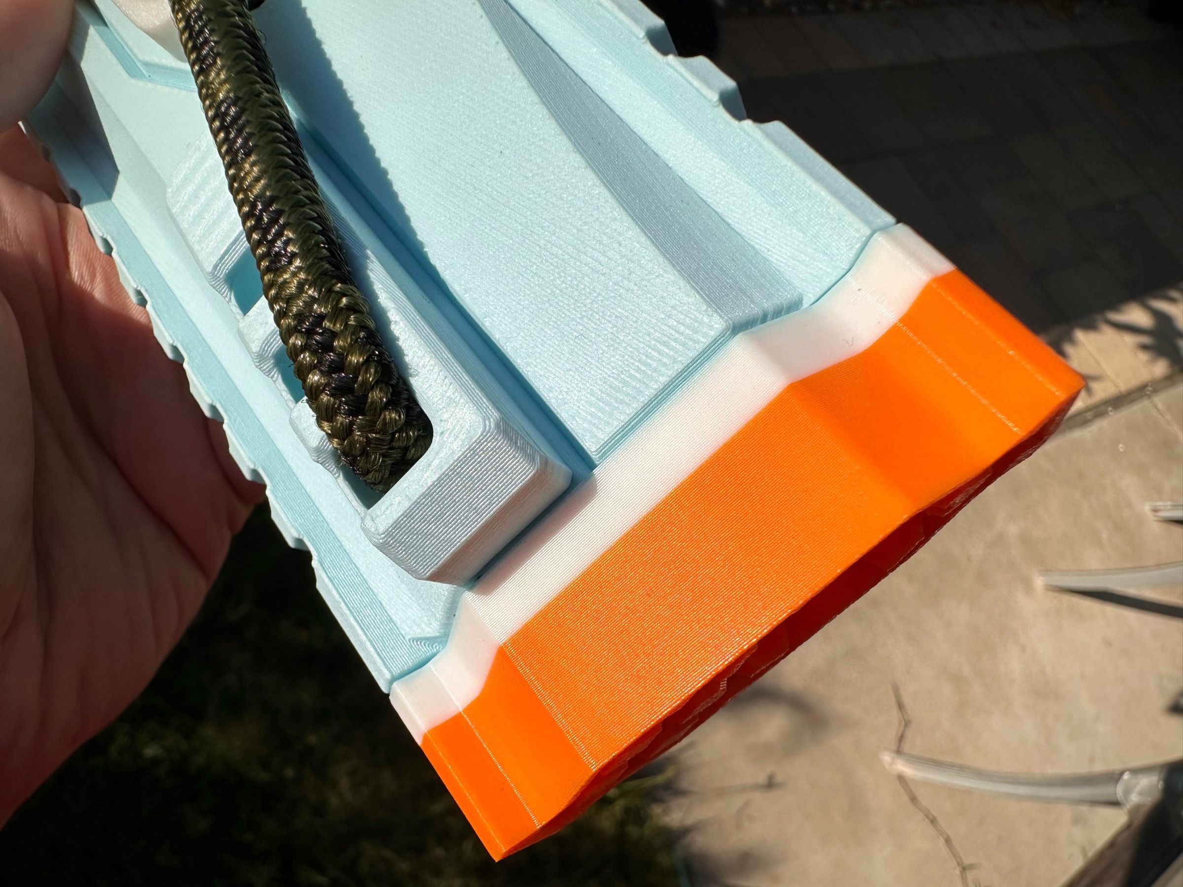The muzzle is actually a three-color print, with orange, white, and (hidden here) ice blue lugs. High-res image here.