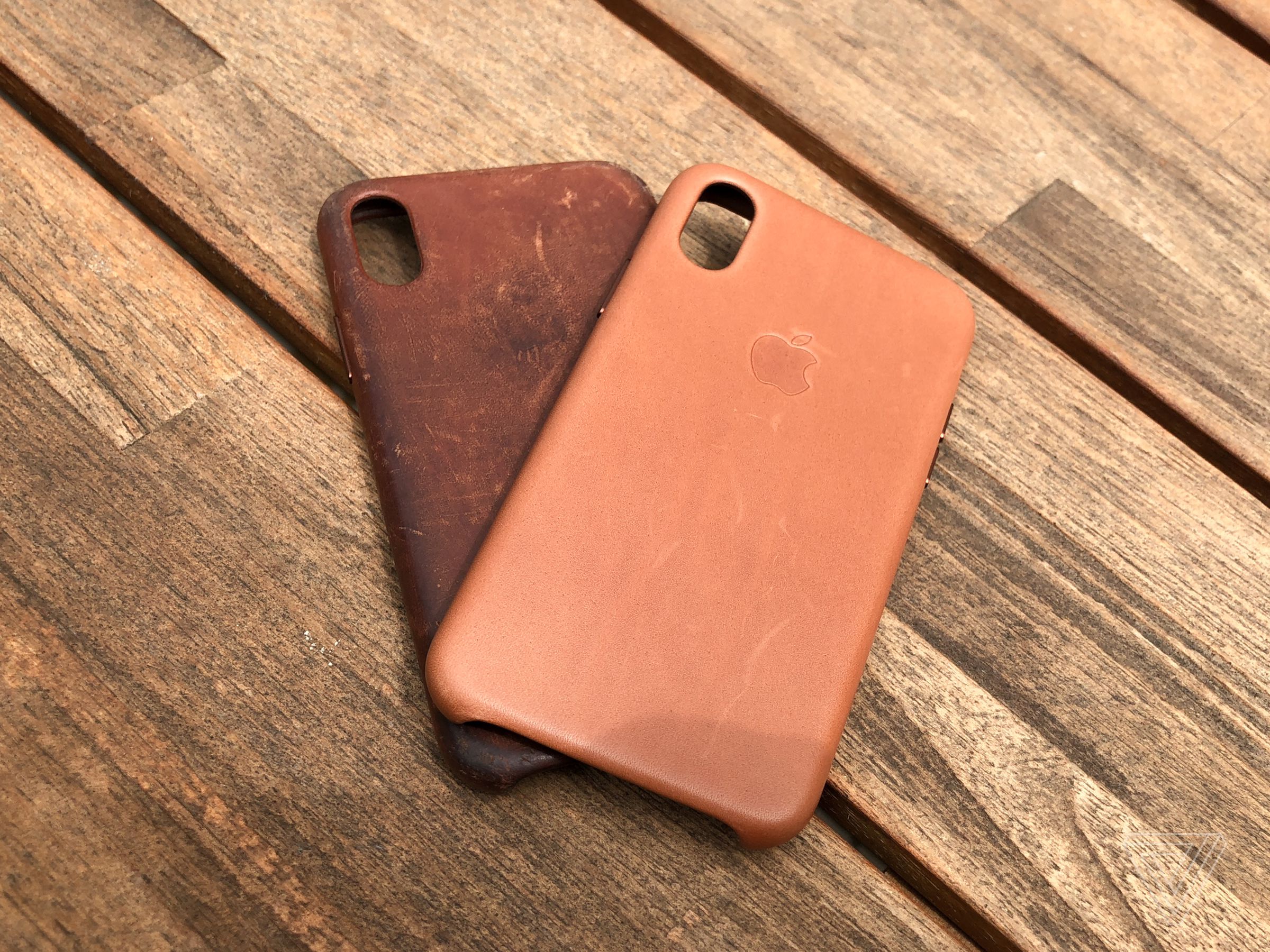 Two iPhone X saddle brown leather cases.