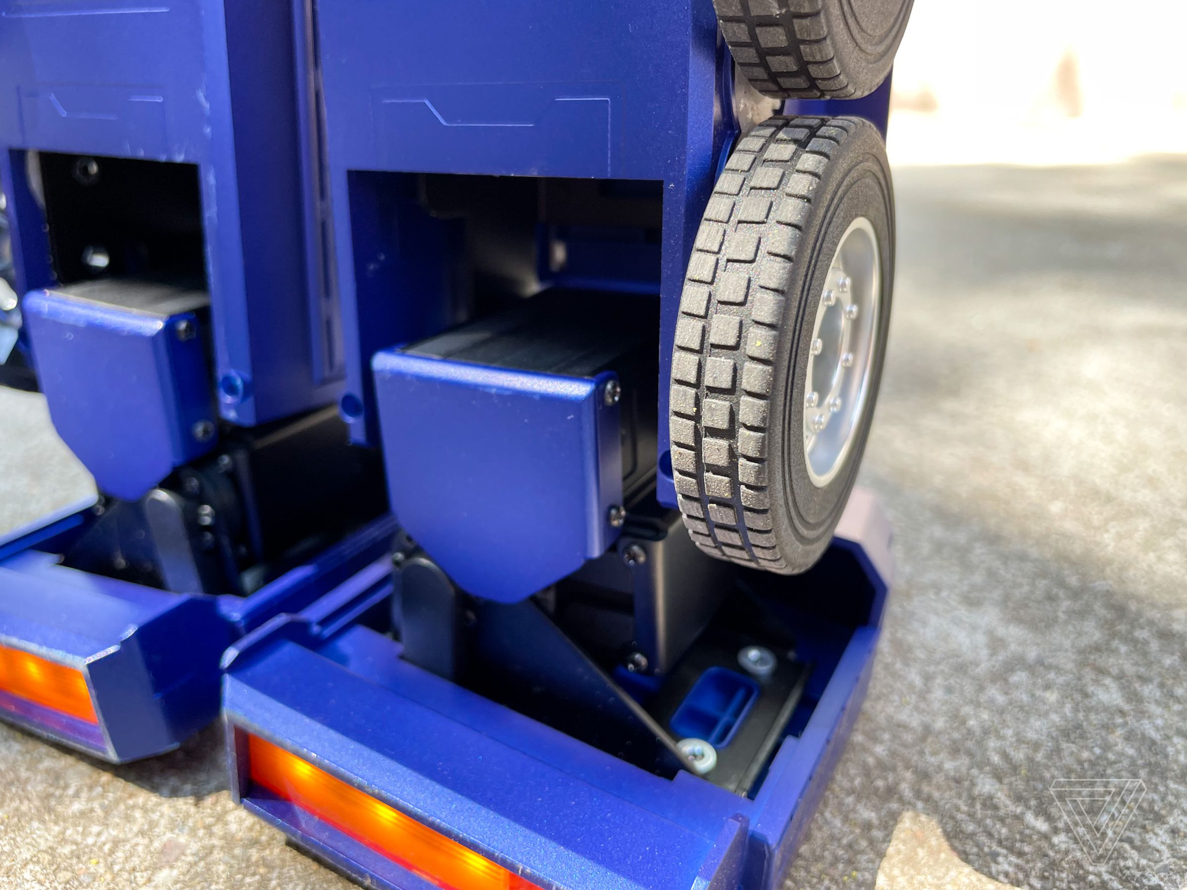 The ankle provides the clearest views of one of the 27 servo motors that power Optimus.