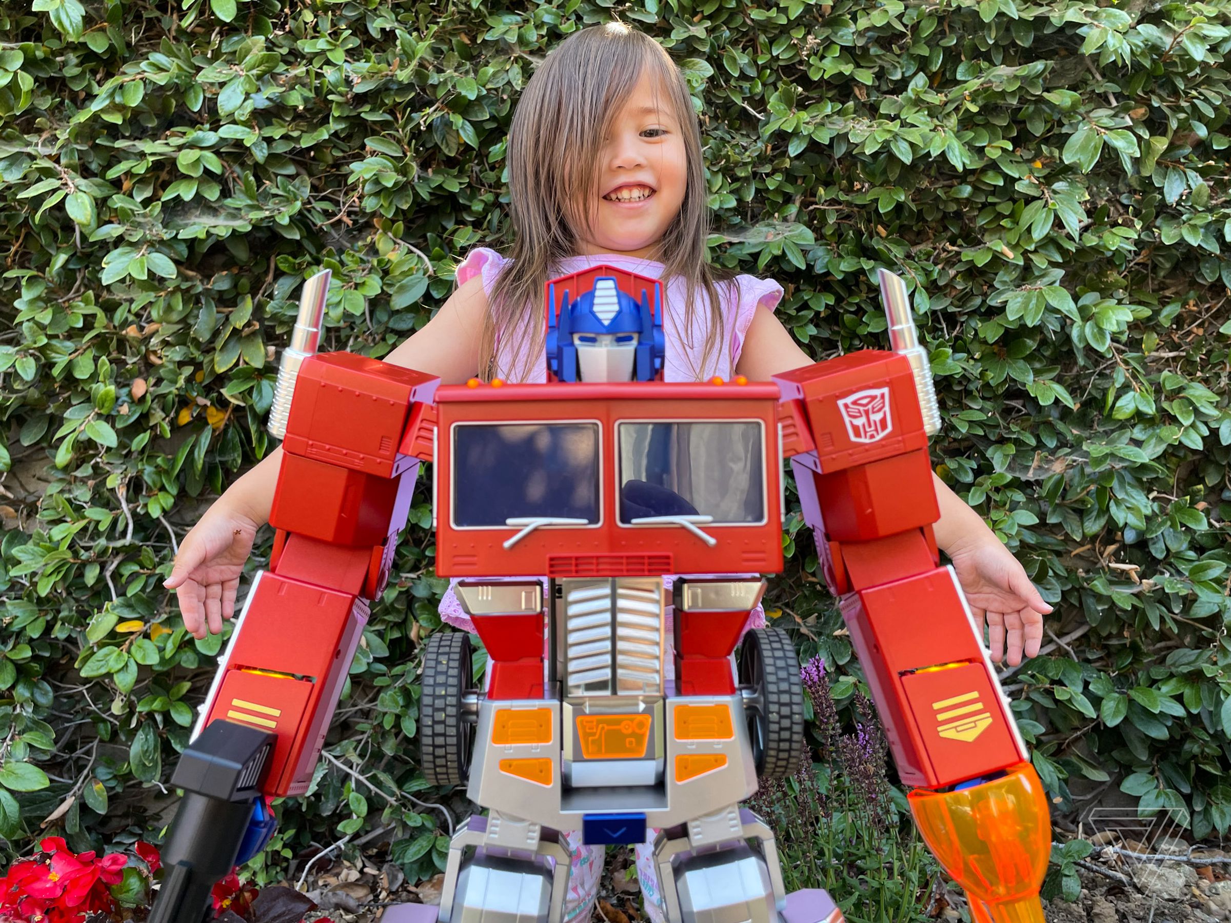 My daughter is much taller than Optimus but she wanted this picture.