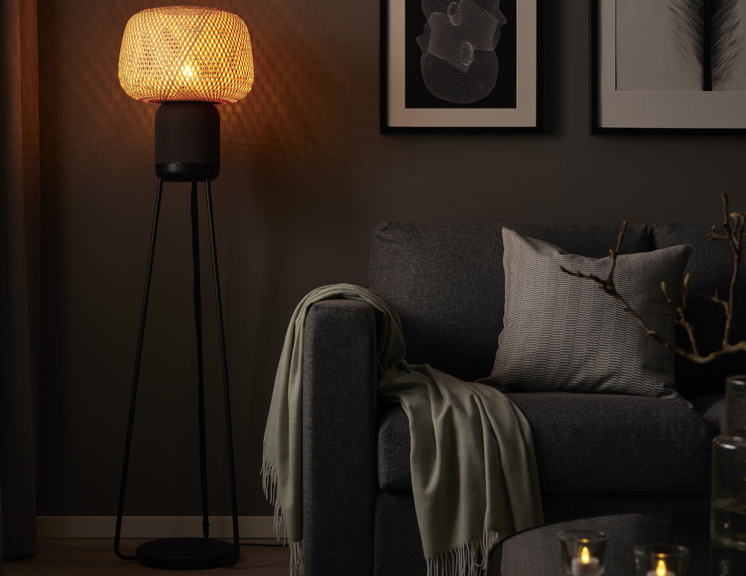 An image of the Symfonisk floor lamp enclosure illuminated in a darkened room.