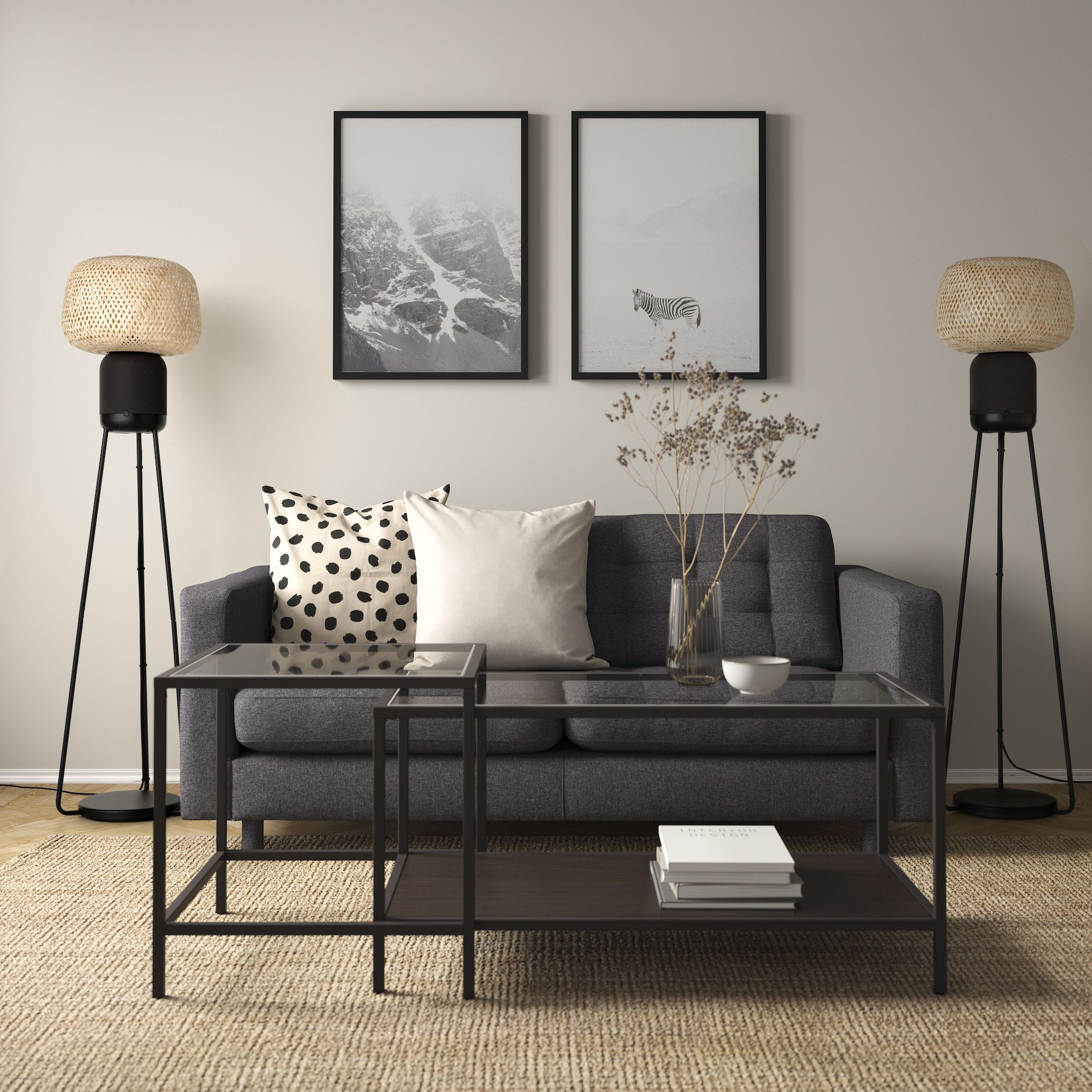 An image of two Symfonisk floor lamp speakers, one on each side of a couch.