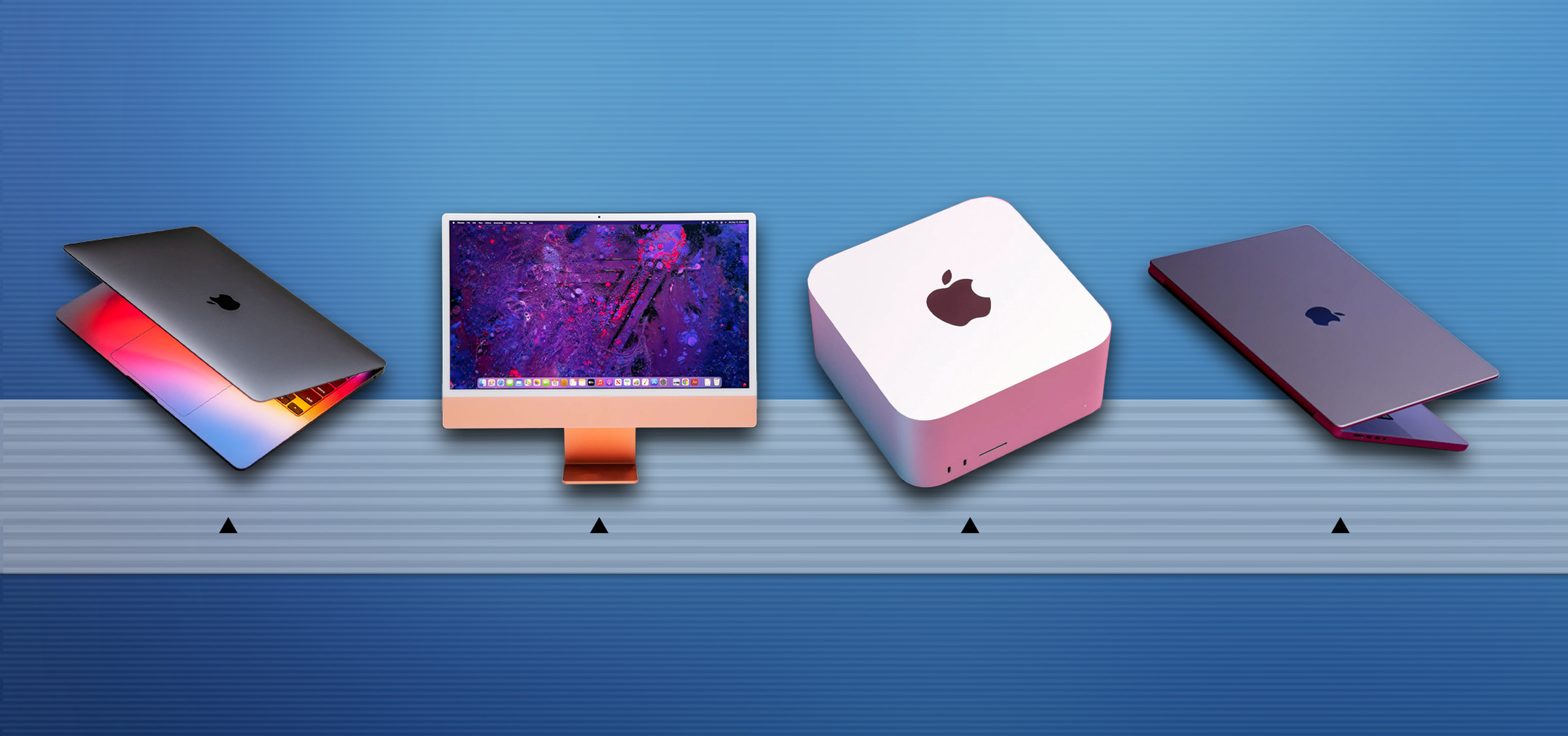 Several Apple Silicon Macs sit on a bar that looks similar to the dock on macOS
