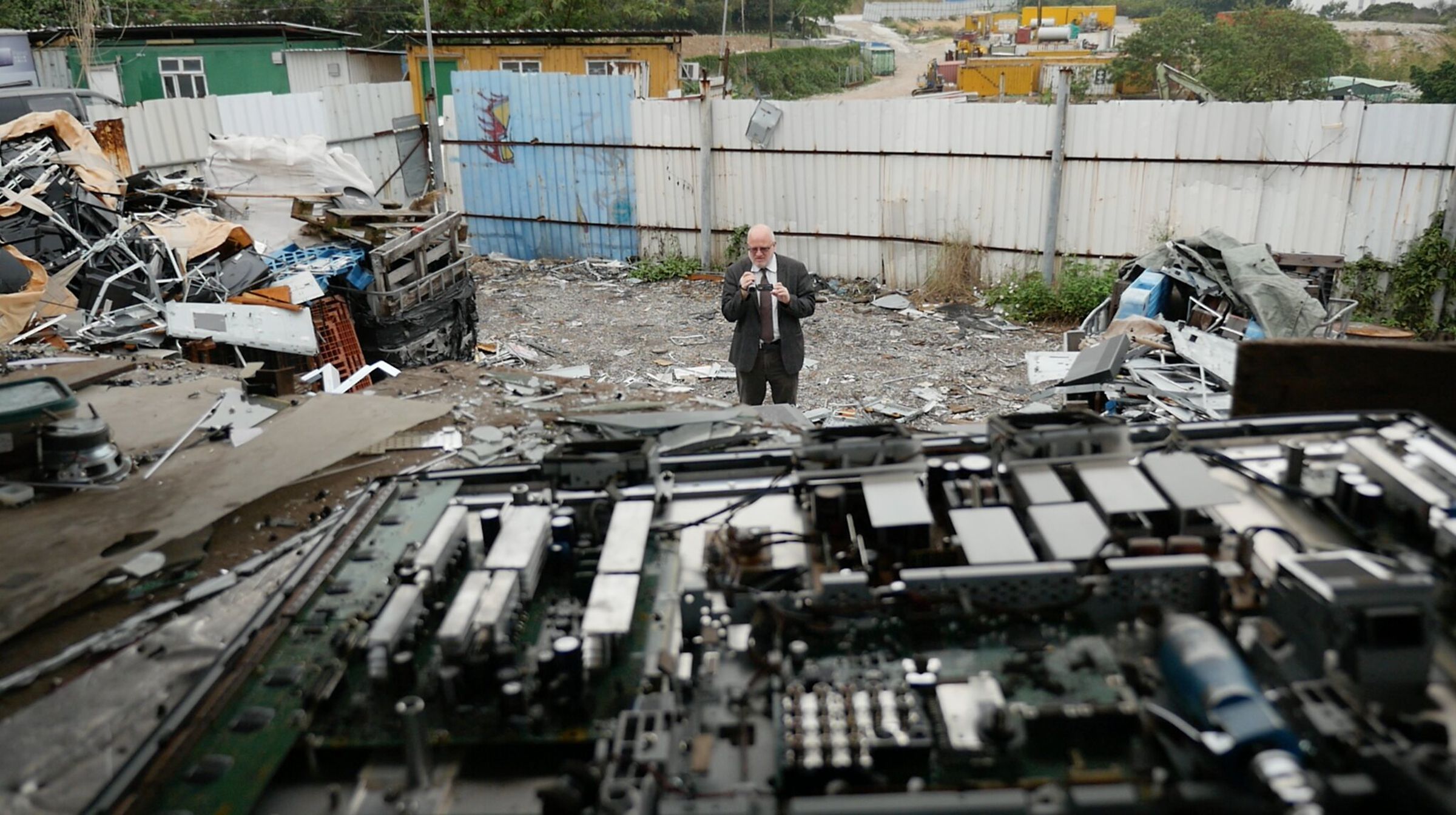 Jim Puckett at a junkyard where workers dismantle flatscreen televisions in Hong Kong.