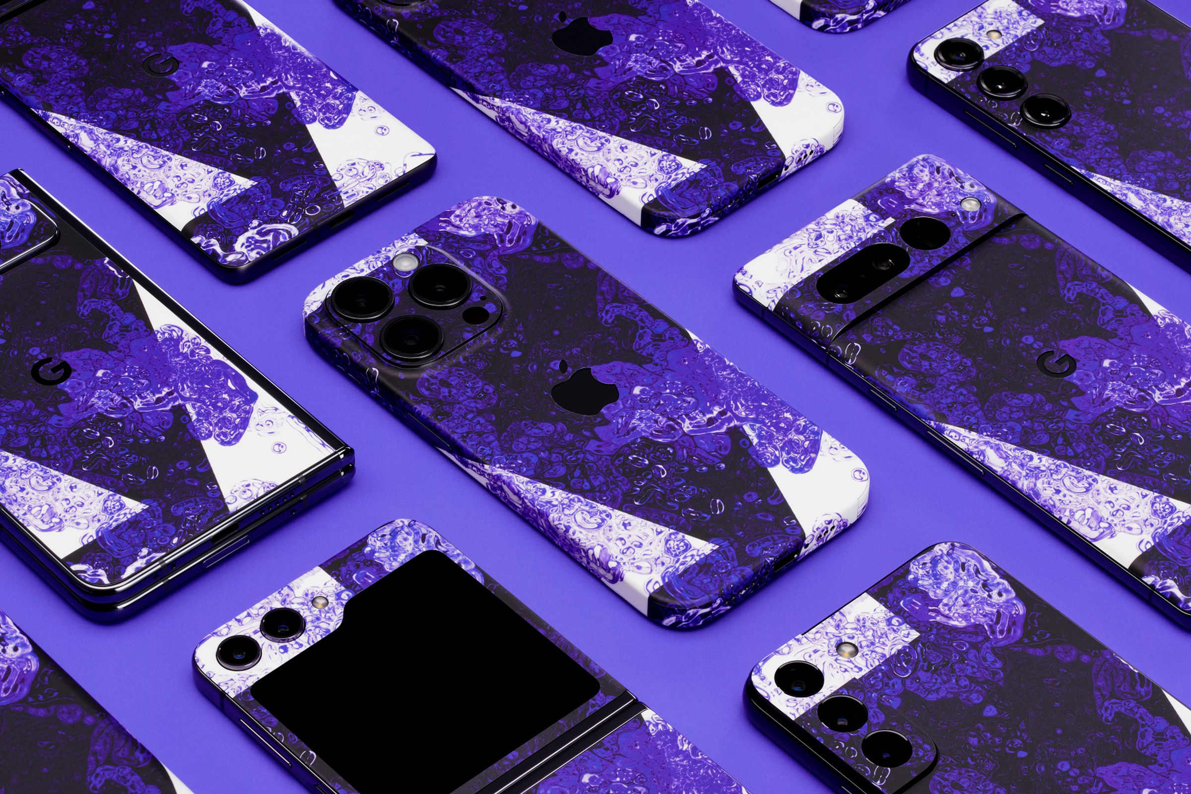 The Verge and dbrand’s Monogram skin applied to a variety of phones
