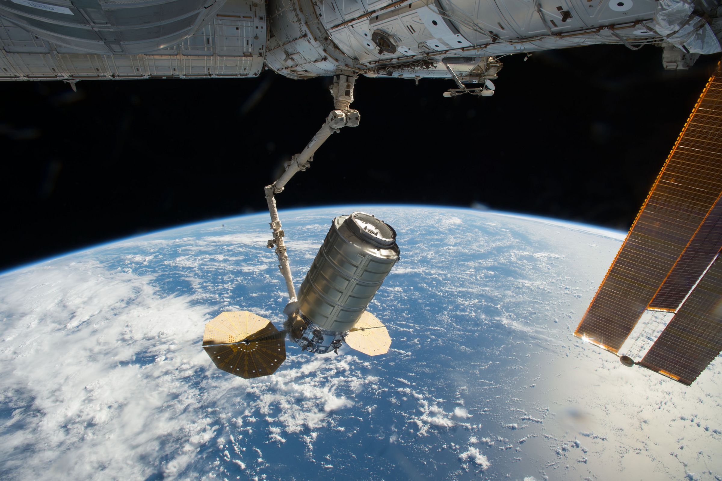 Orbital ATK’s Cygnus cargo capsule attached to the station’s robotic arm.