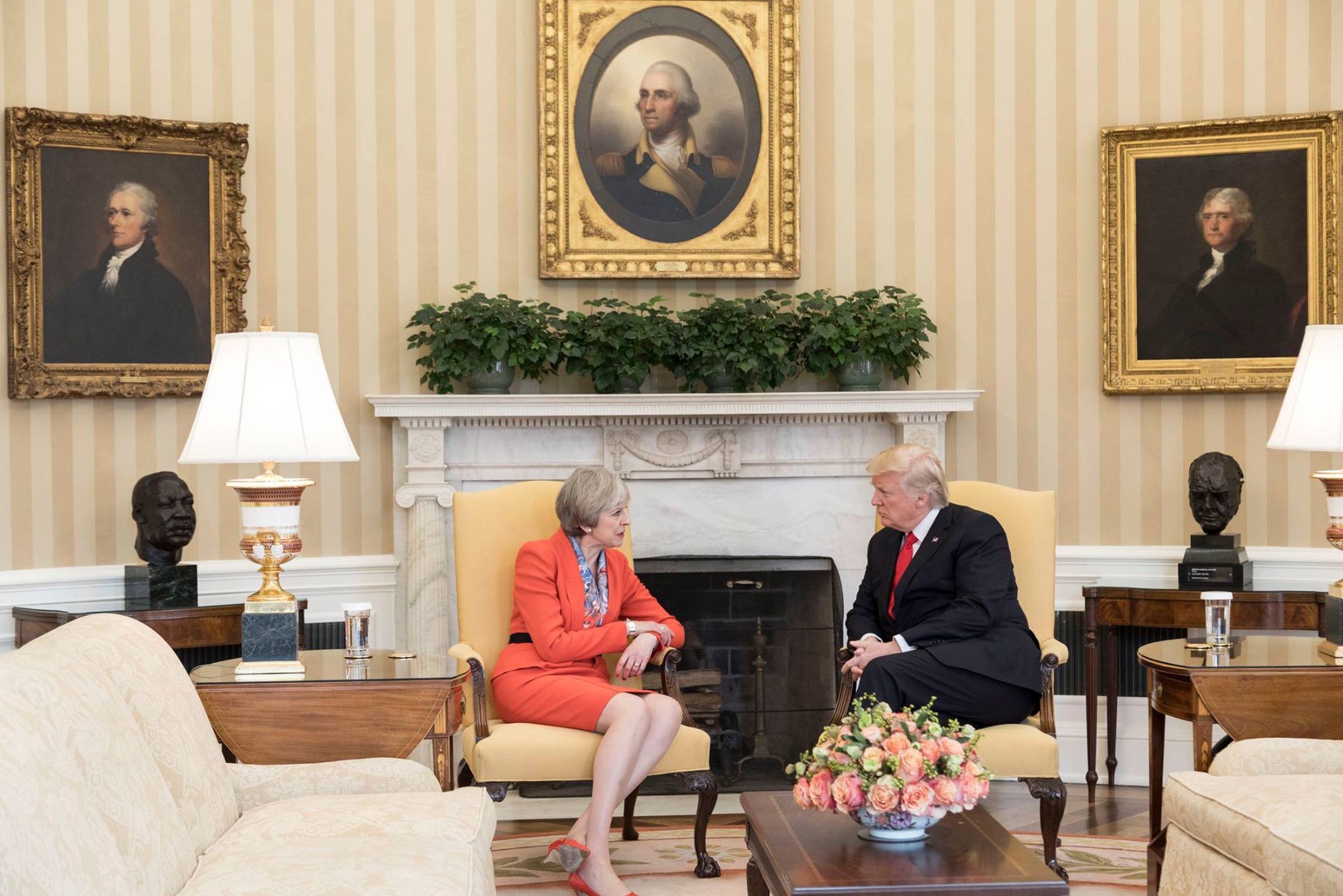 Trump is photographed meeting with British Prime Minister Theresa May, with portraits of past presidents in the frame. It borrows a nearly identical framing as one of the other 50 photos in the only gallery of Craighead’s work so far.