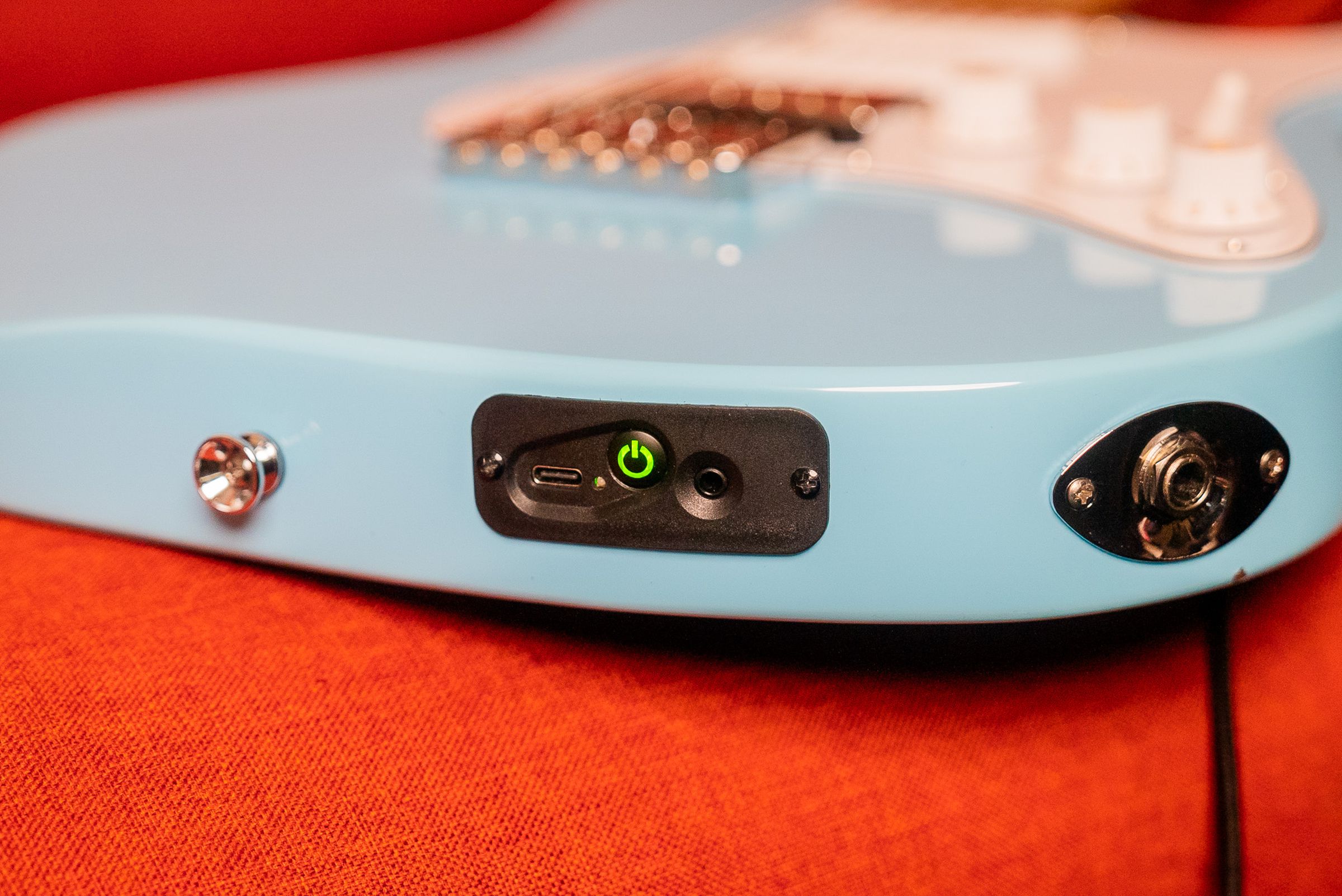 A view of the button of the guitar with both ports.