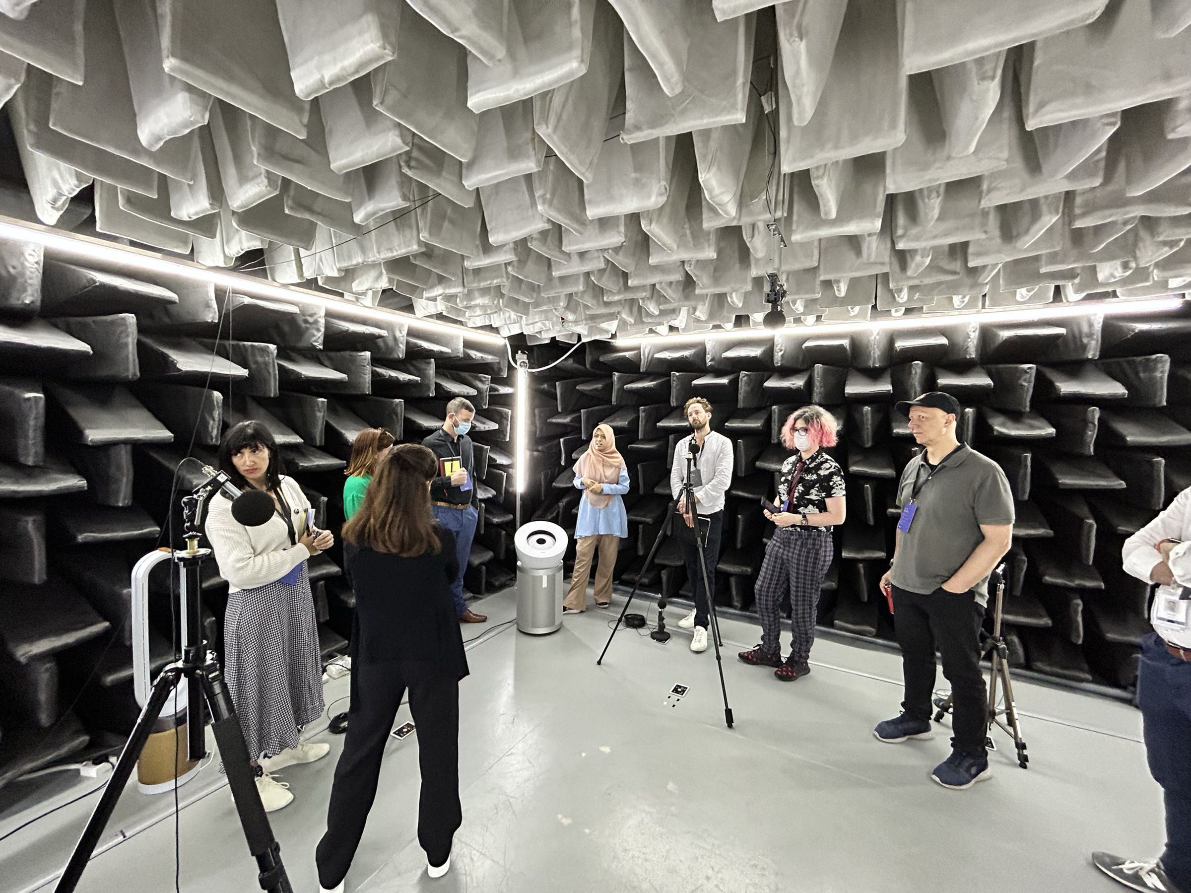 The semi-anechoic chamber where Dyson tests the noise level of its air purifiers. Dyson employees and journalists gather around a new Dyson Big + Quiet purifier in the corner.