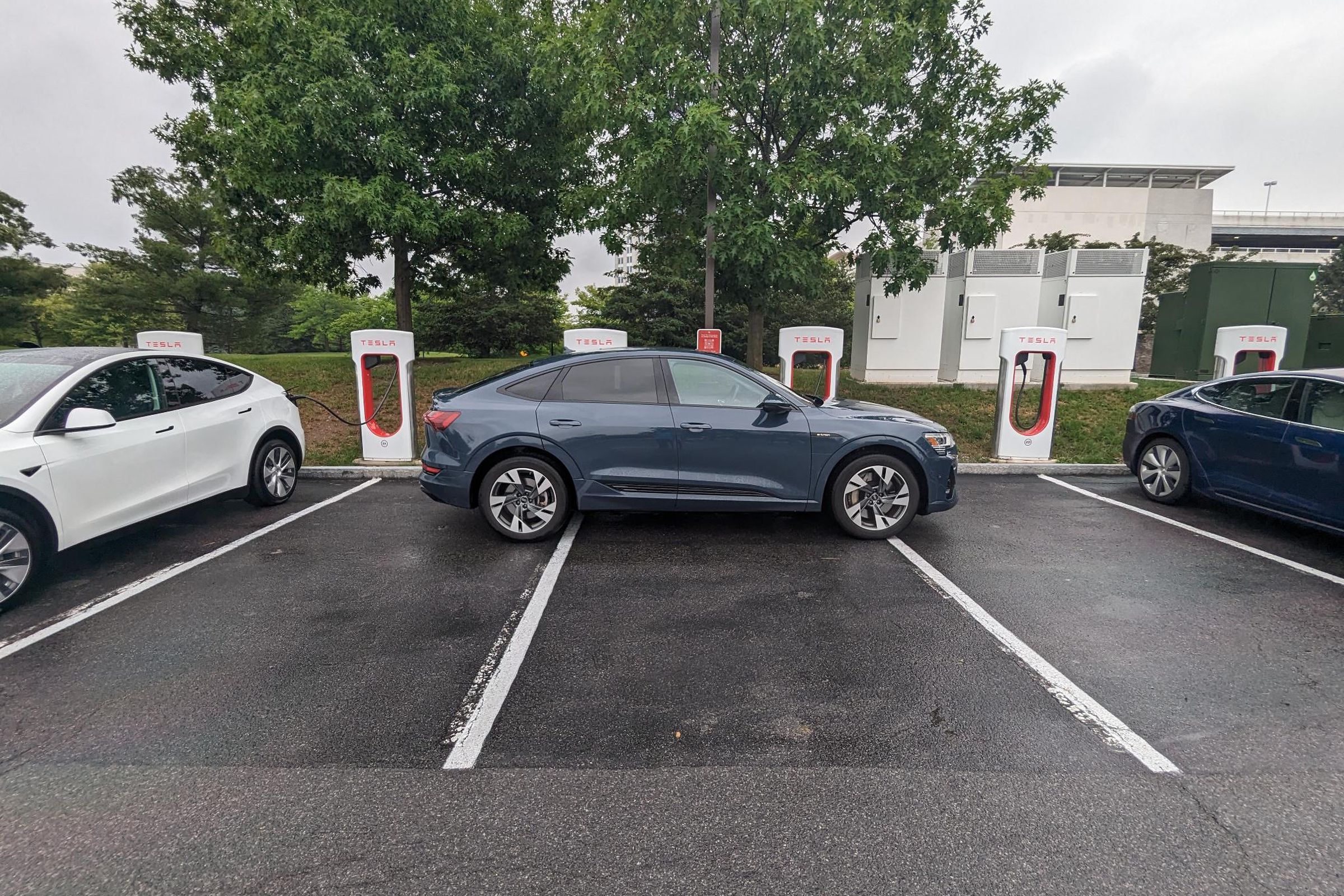 Audi E-tron charging at Tesla Supercharger