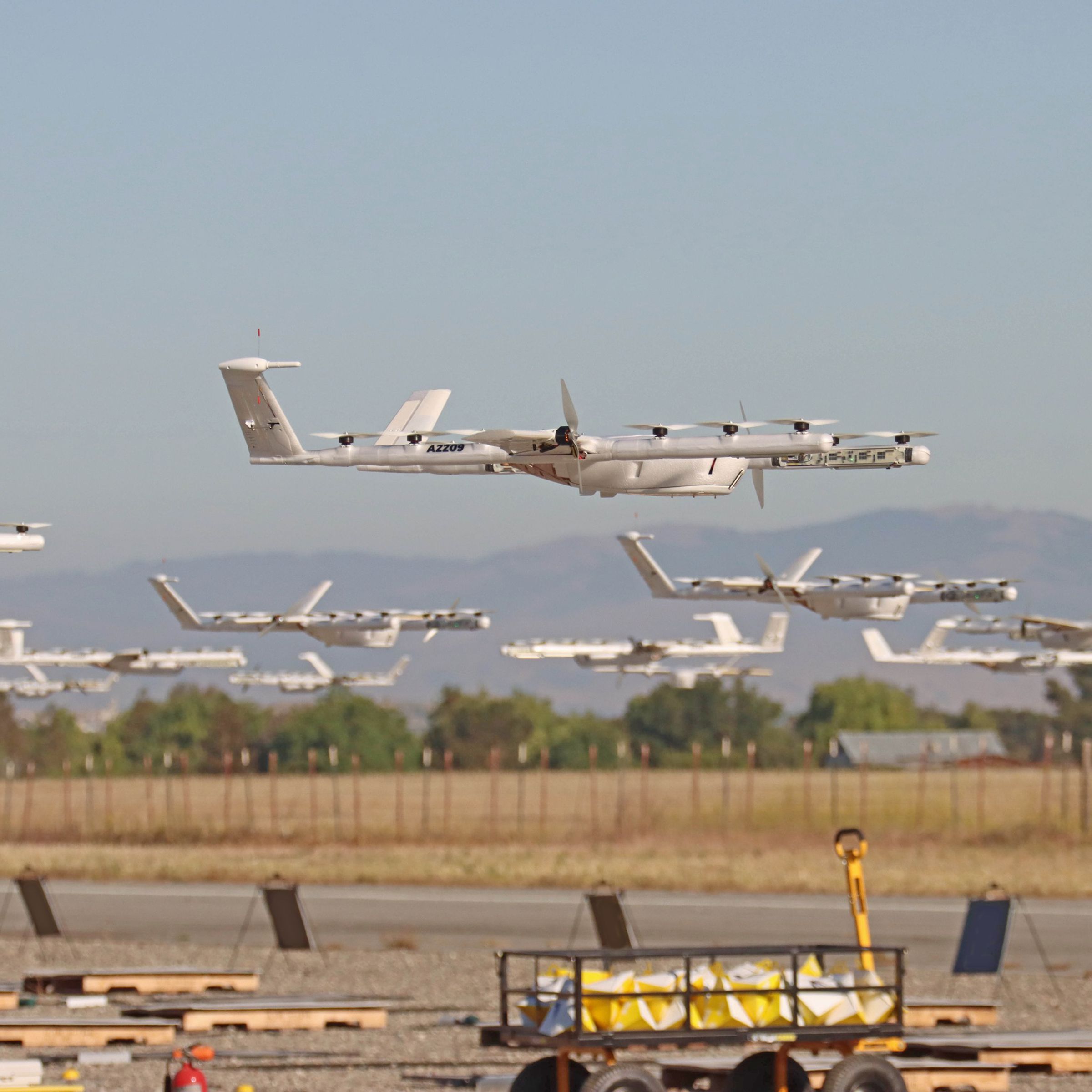 A fleet of Wing delivery drones perform autonomy tests first thing in the morning. 