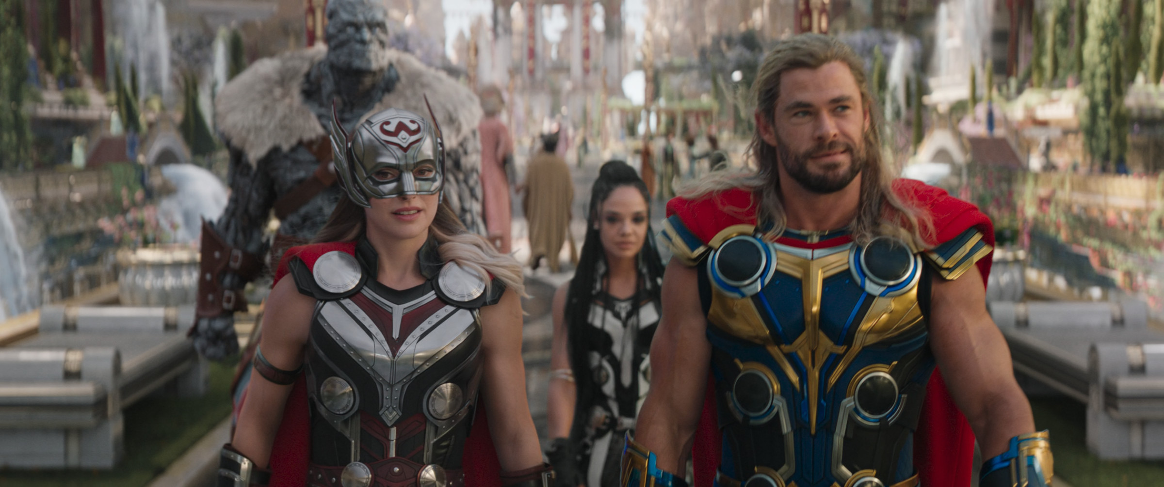 Natalie Portman as Mighty Thor, Tessa Thompson as King Valkyrie, and Chris Hemsworth as Thor.