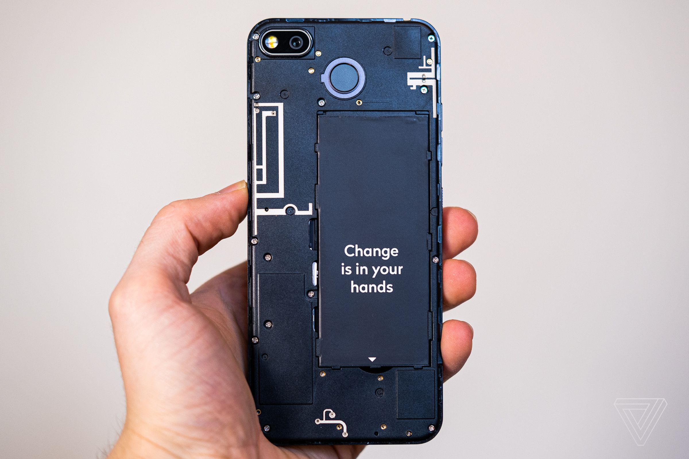 Take off the phone’s back, and you’ll find a removable battery and a set of easily accessible screws.