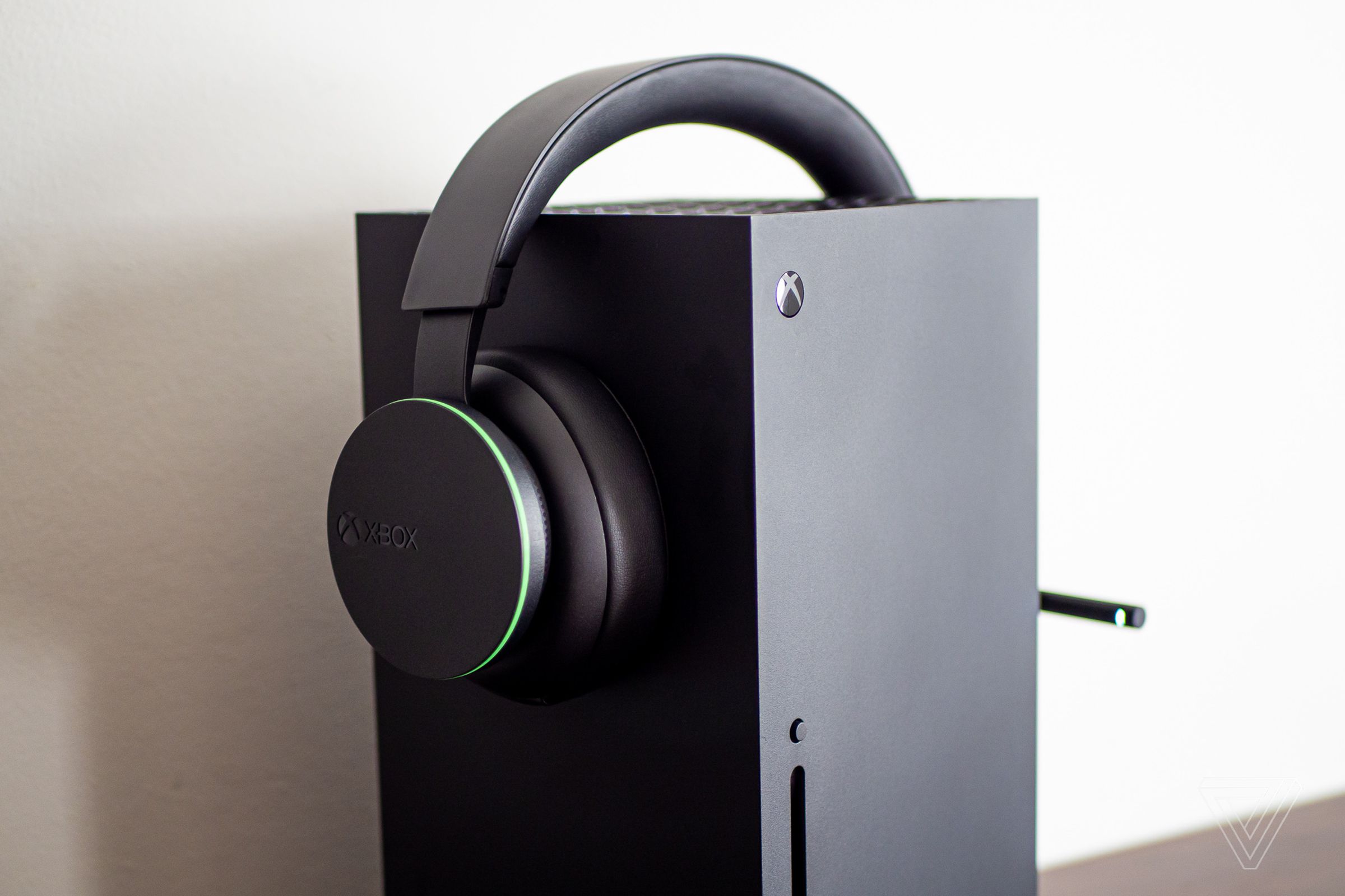 An Xbox wireless headset on top of an Xbox Series X console