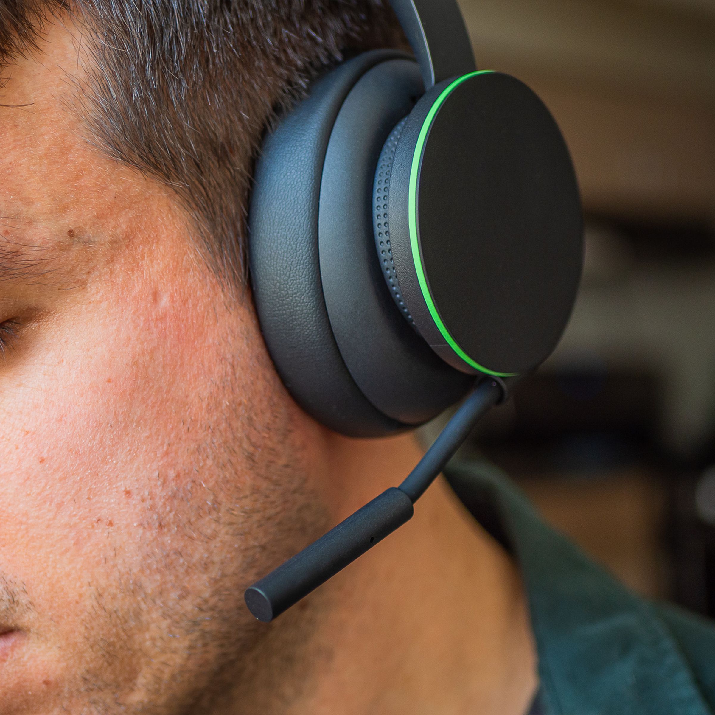 A close-up image of a male wearing the Xbox Wireless Headset.