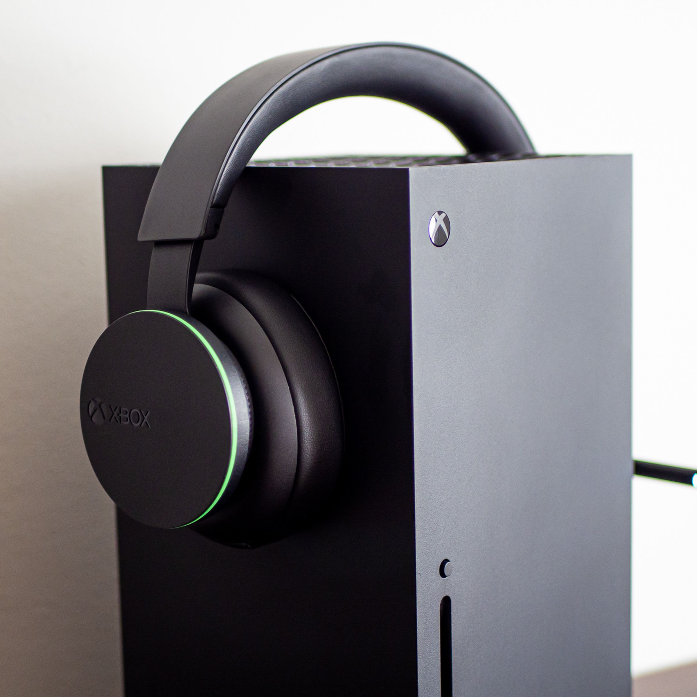 An Xbox wireless headset on top of an Xbox Series X console