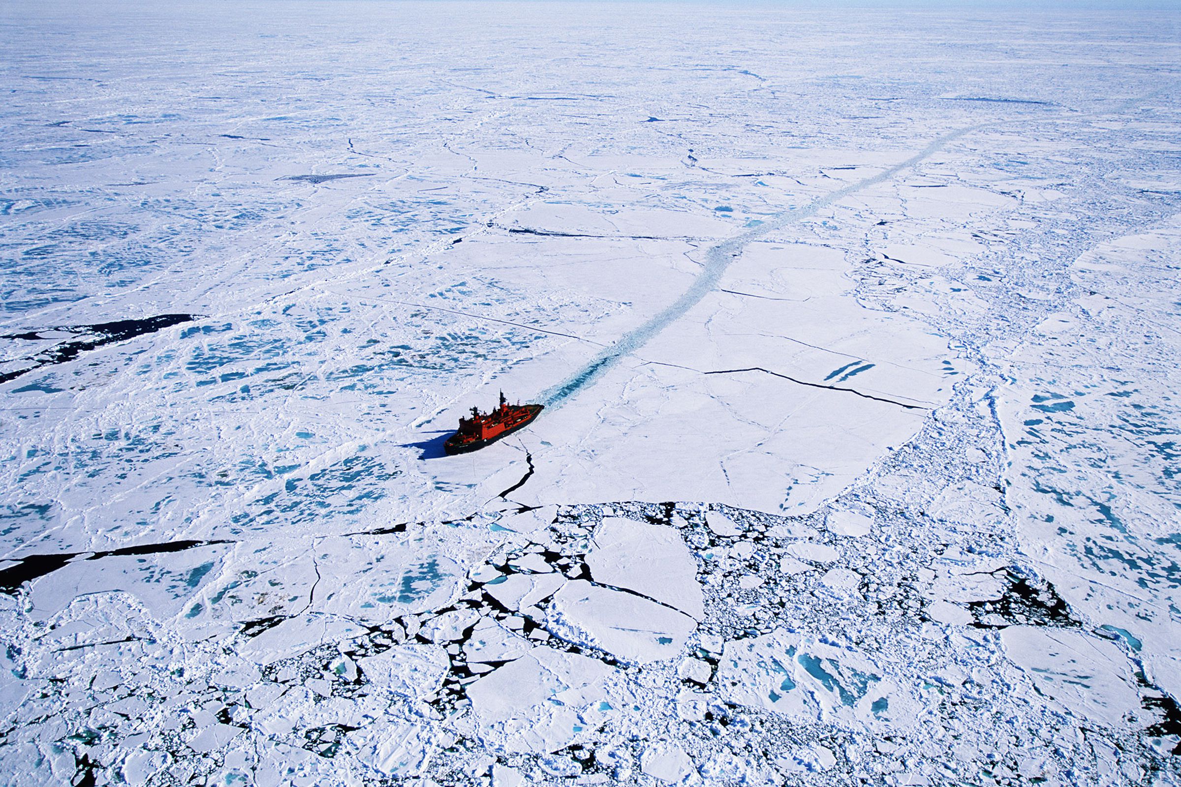 An aerial view of a Russian nuclear icebreaker clearing a path in ice to North Pole