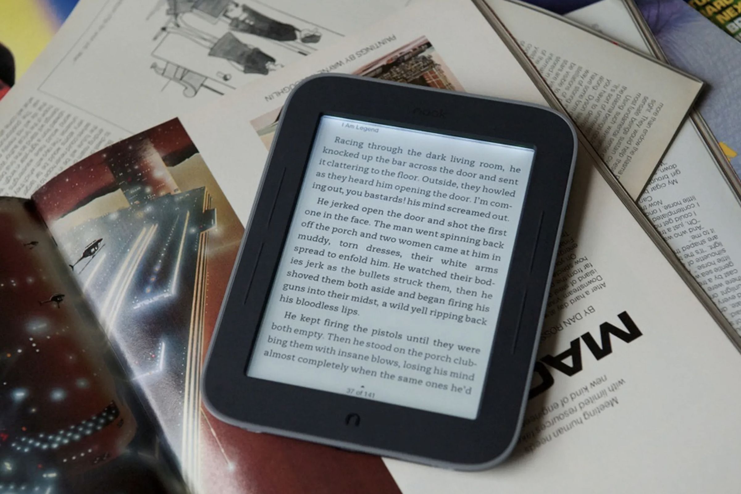 Old nook e-reader with a book open