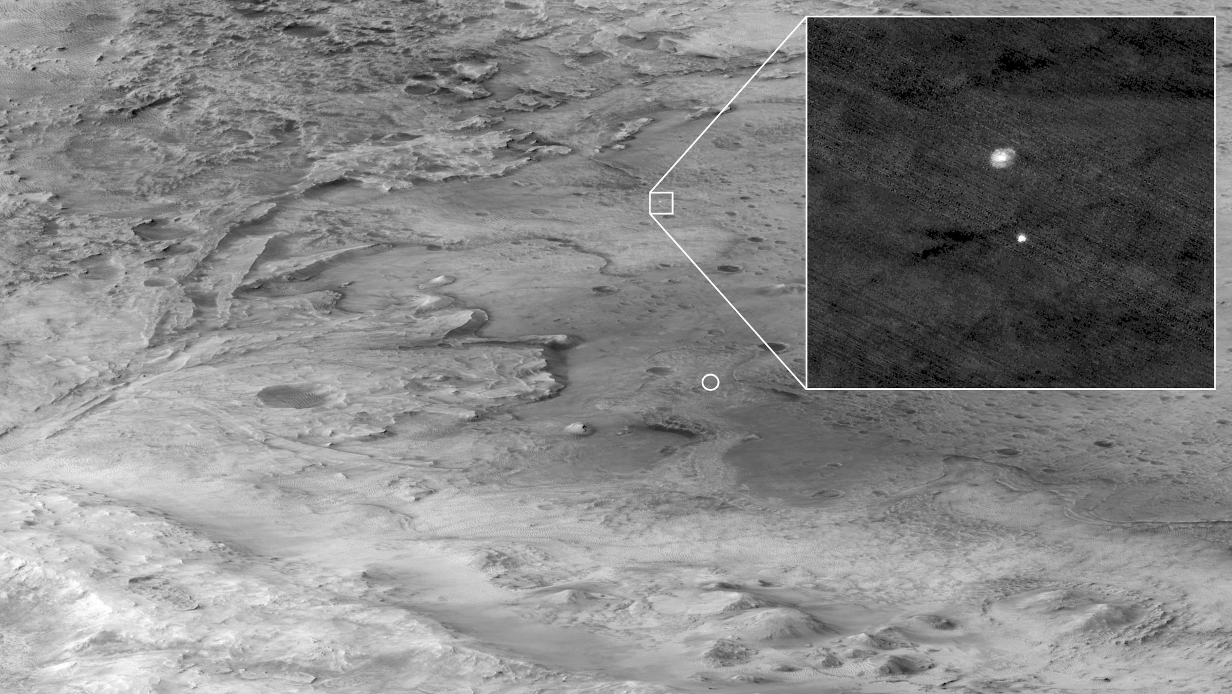 An image captured by the Mars Reconnaissance Orbiter shows Perseverance descending under its parachute moments before landing.