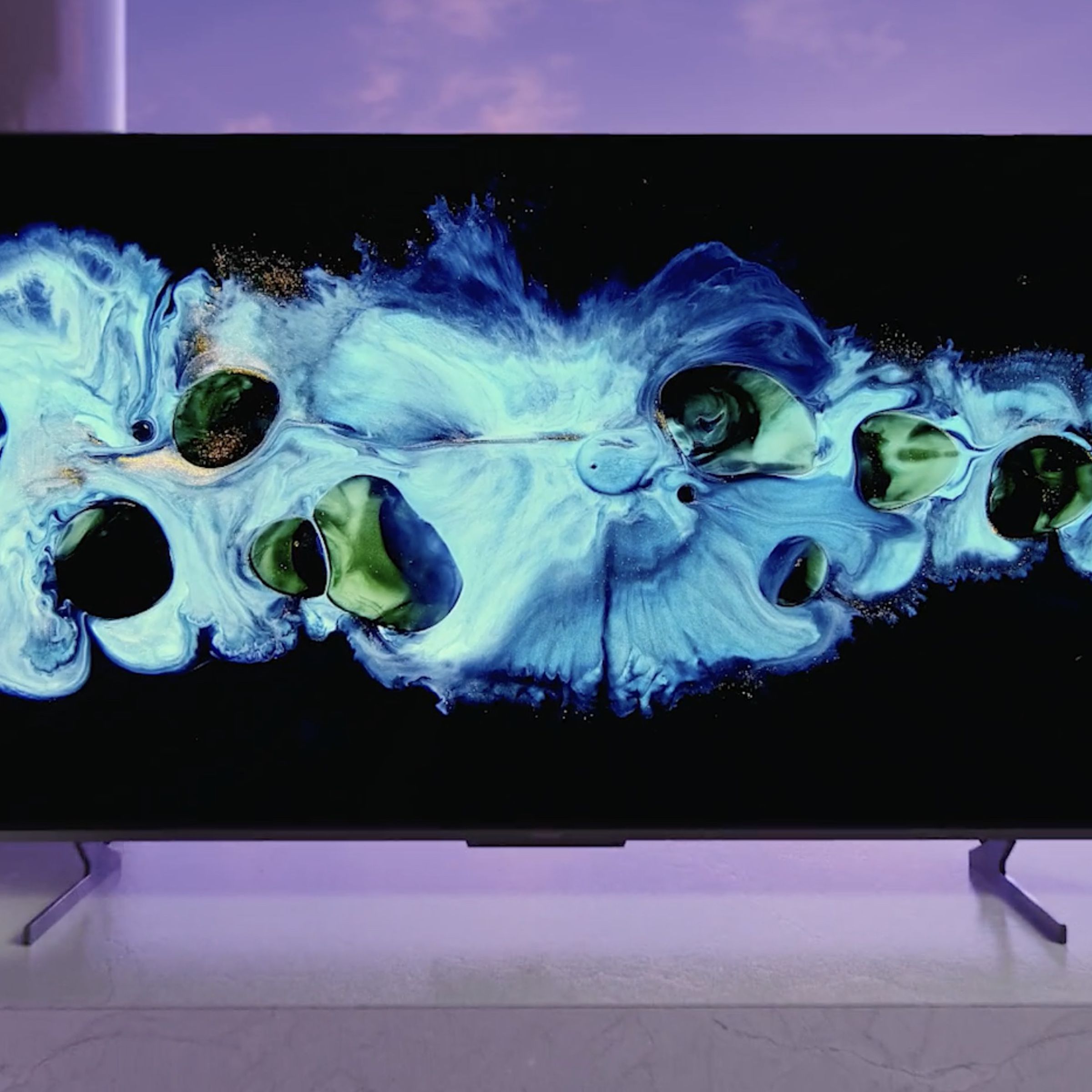 A press image / render of Hisense’s U8H with a colorful graphic displayed on its screen.