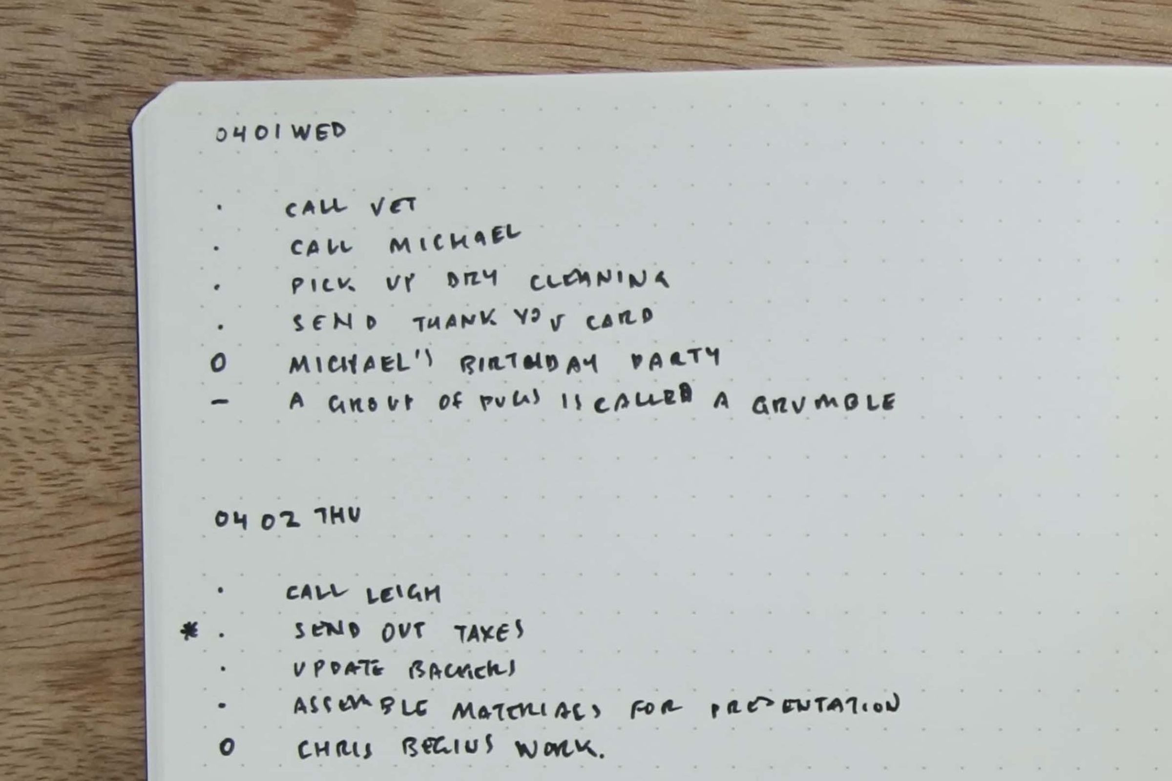 A to-do list written in a physical notebook.
