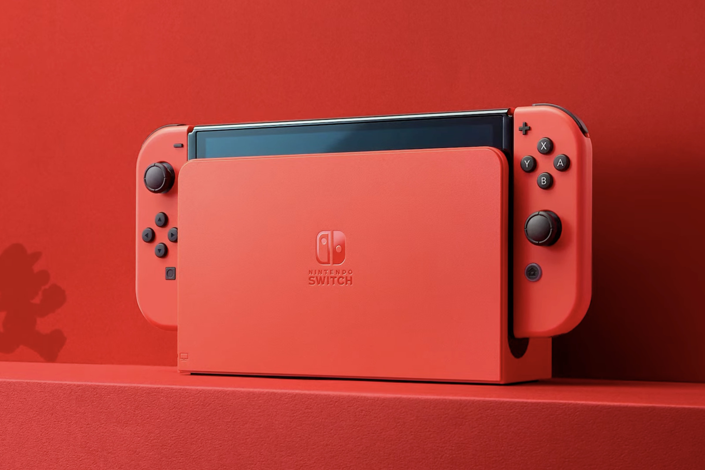 A red Nintendo Switch OLED.