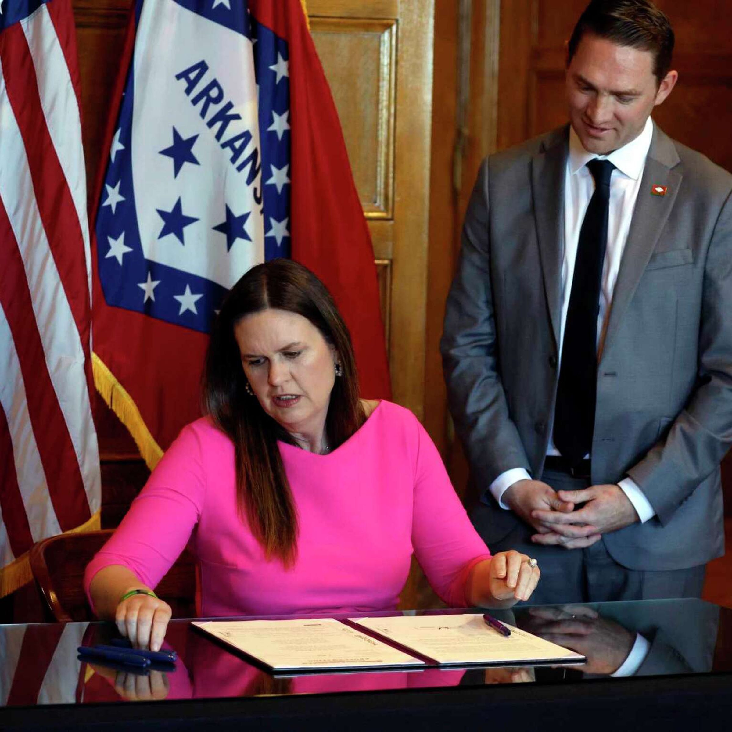Arkansas Governor Sarah Huckabee Sanders signing in the Social Media Safety Act.