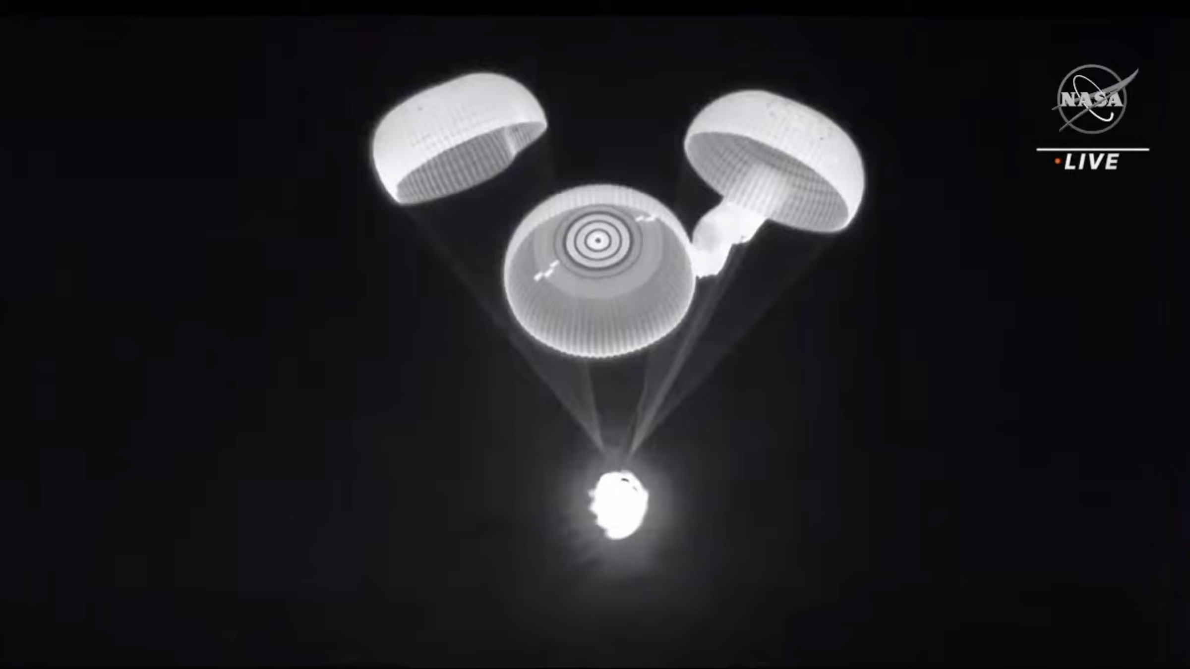 The fourth main parachute taking longer to inflate than the others.