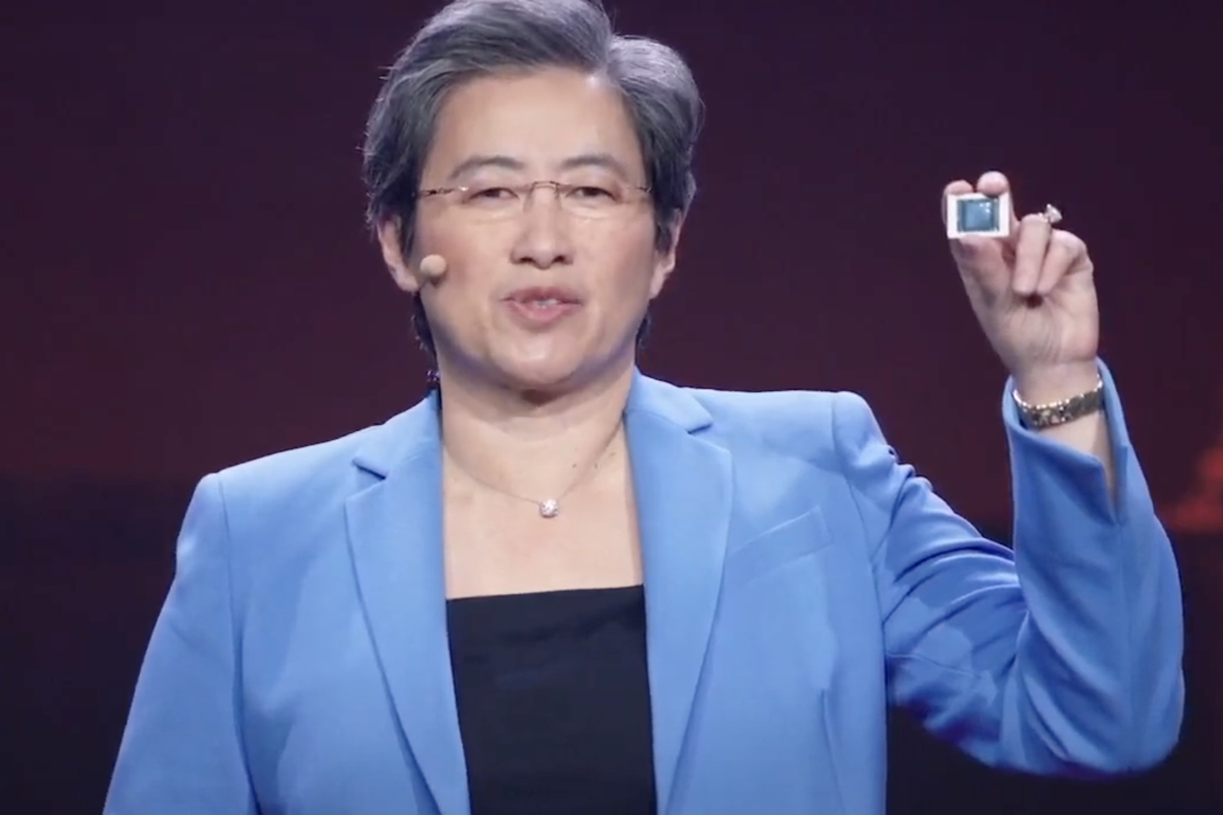 AMD CEO Lisa Su holds up a Ryzen 5000 mobile chip at CES 2021.