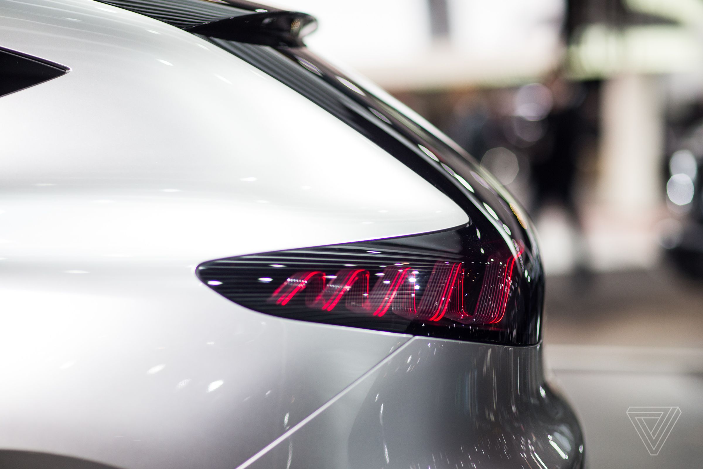 The wavy tail lights of the EQA concept flicker and pulse.