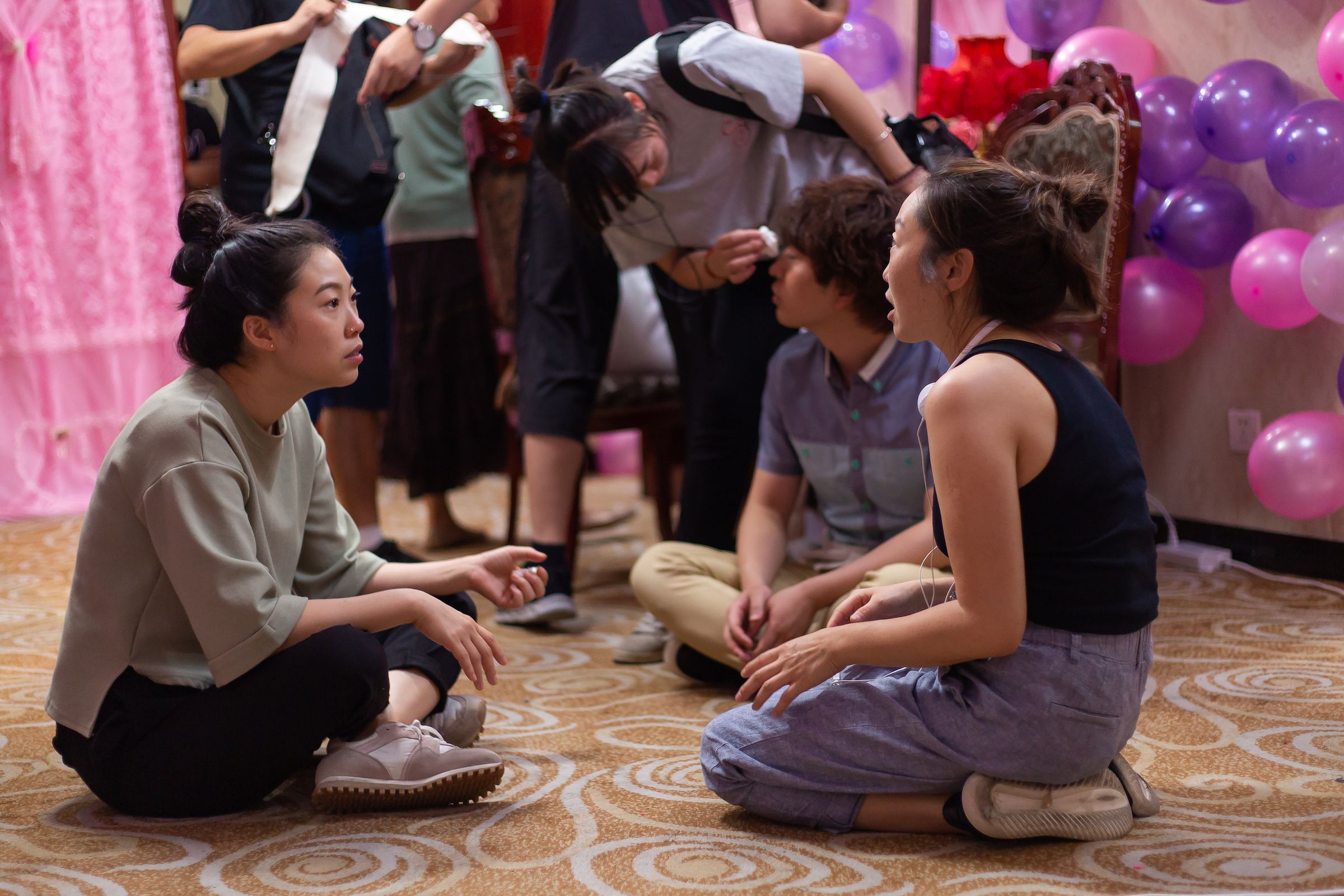 Awkwafina (left) and writer-director Lulu Wang on the set of The Farewell.