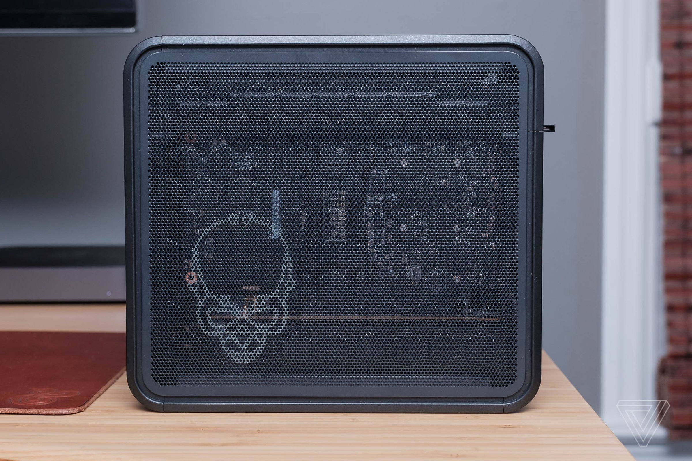 The mesh sides help keep the NUC 9’s powerful components cool. They also have a skull printed on them.