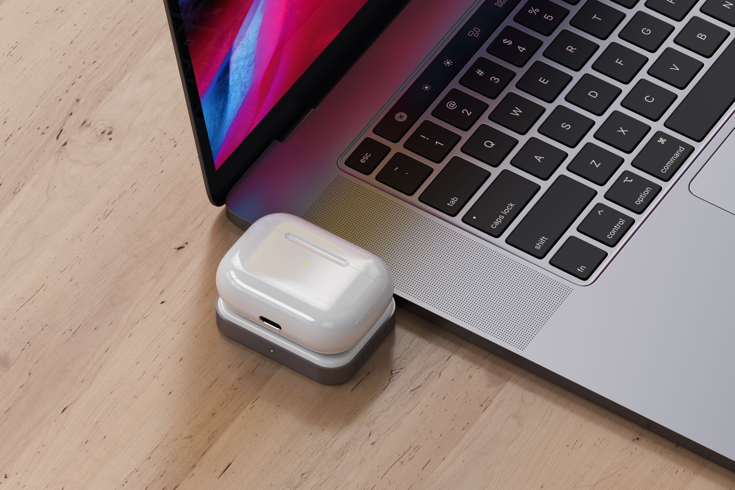 You plug the wireless charger into a spare USB-C port, and place your AirPods case on it for wireless charging.