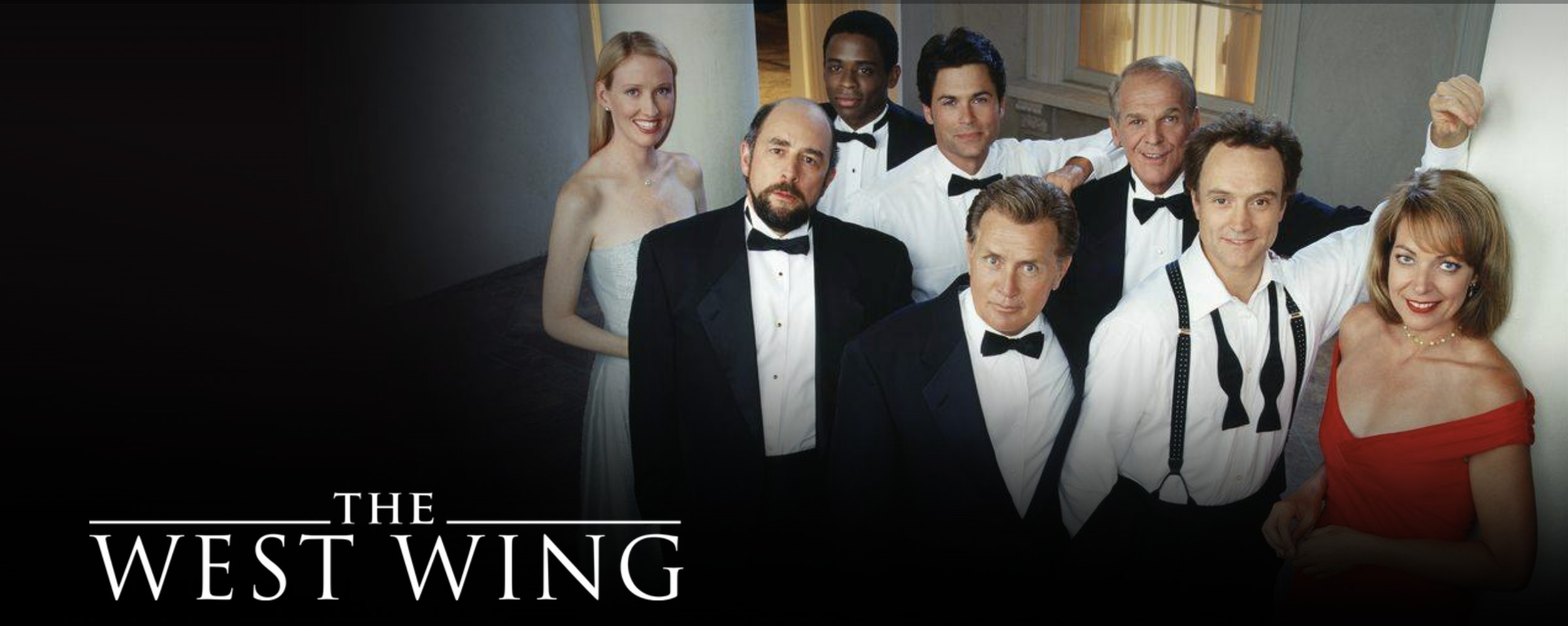 Promo photo with “The West Wing” in lower left and cast in formal clothes center right.