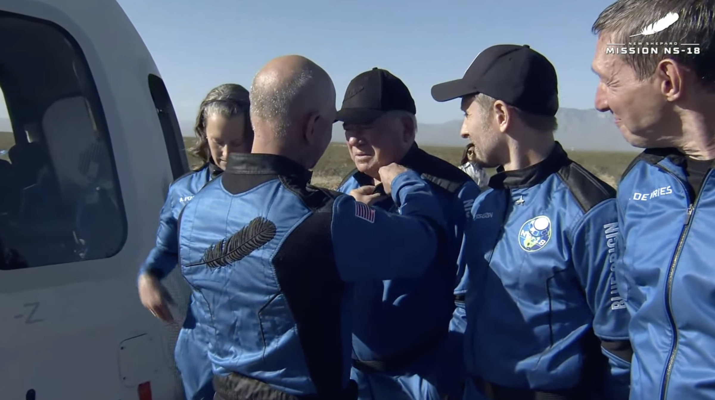 Jeff Bezos pins Blue Origin astronaut wings on William Shatner after the flight