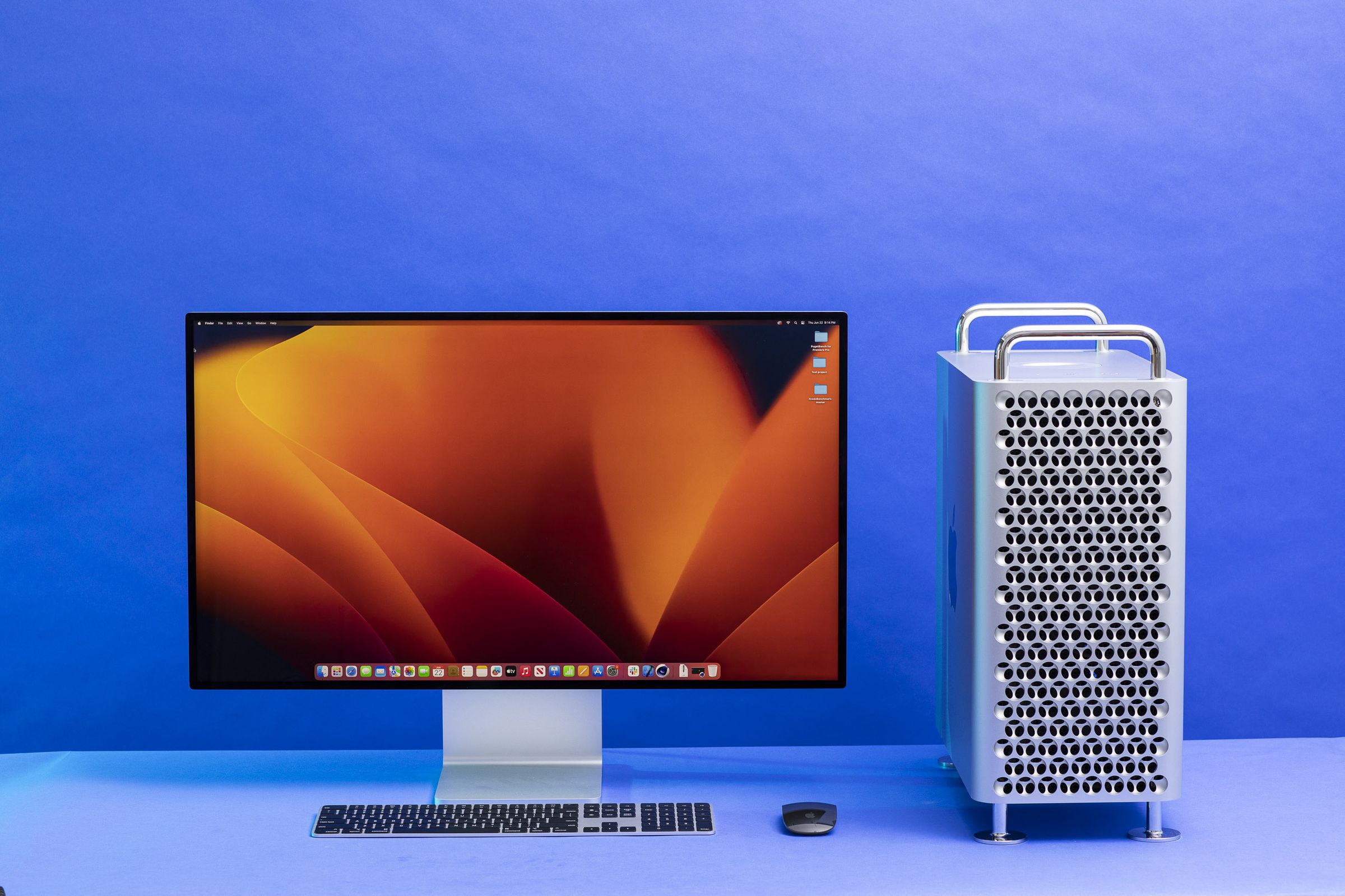 The Mac Pro beside the Pro Display XDR, a magic keyboard, and magic mouse.
